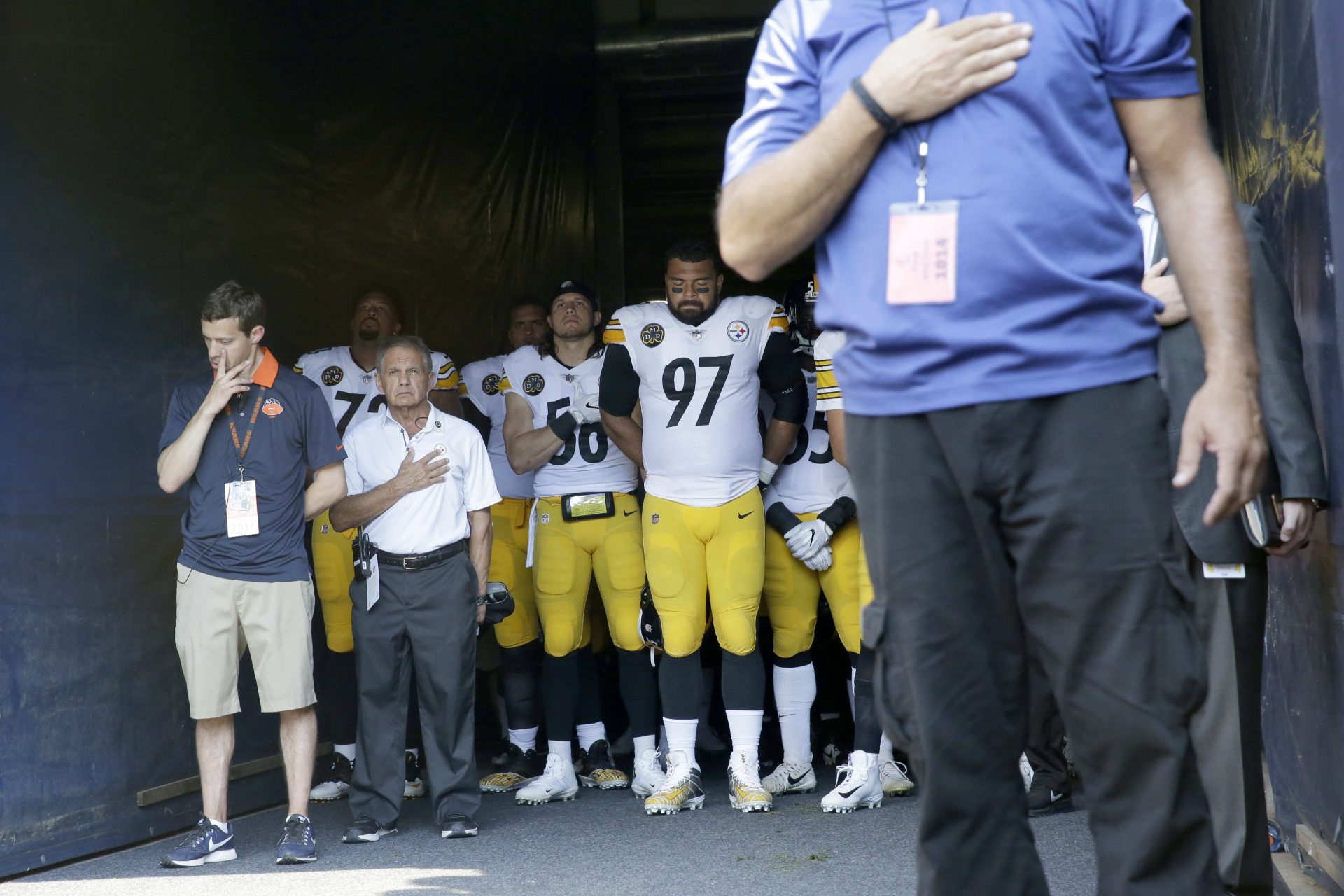 Pittsburgh Steelers players stand in the tunnel during the playing of the national anthem before an NFL football game against the Chicago Bears, Sunday, Sept. 24, 2017, in Chicago.