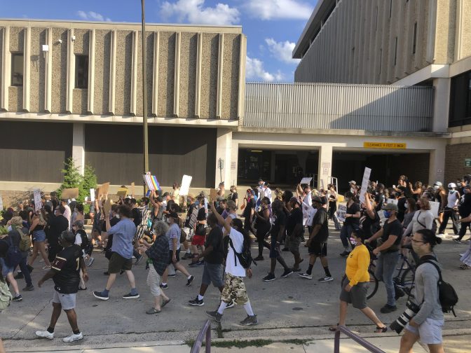 Protesters march past the police department in Allentown, Pennsylvania, on Monday, July 13, 2020, to demand accountability from police after video emerged of an officer placing his knee on a man's head and neck area outside a hospital. Police have launched an internal probe.
