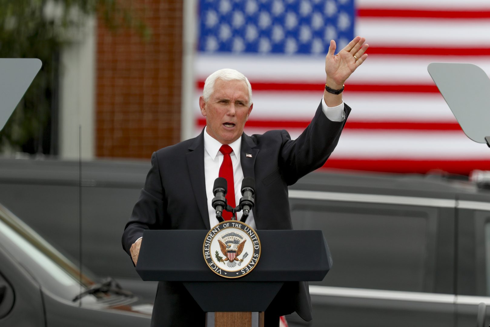 Vice President Mike Pence waves after he spoke at a 