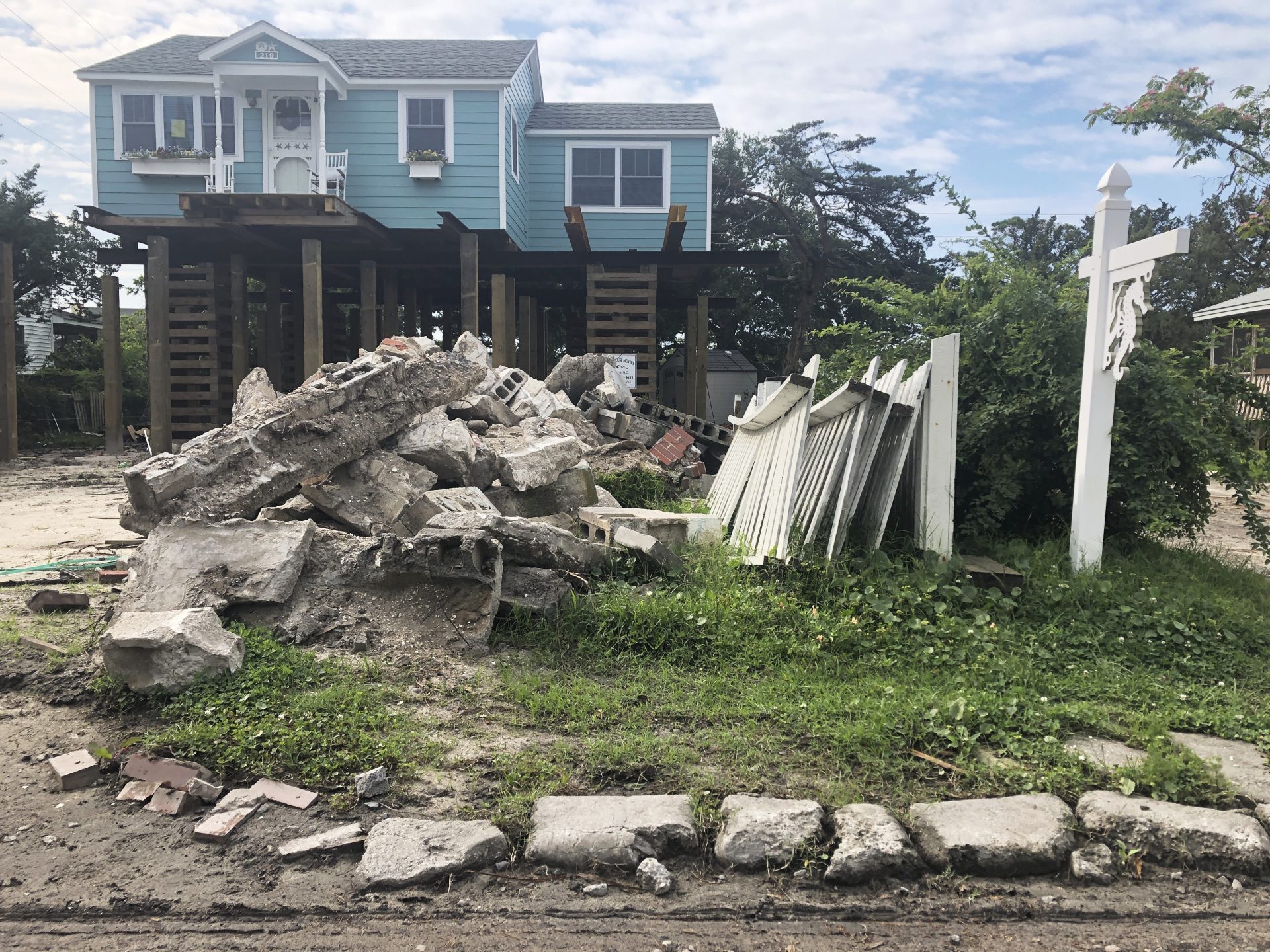 A house is being raised on Ocracoke Island in Ocracoke, N.C., Thursday, June 25, 2020. The secluded travel destination was ravaged by Hurricane Dorian in September and then hit with coronavirus-related travel restrictions in the spring. Residents and business owners are hoping to recoup some of their losses as tourists return, albeit in smaller than usual numbers.