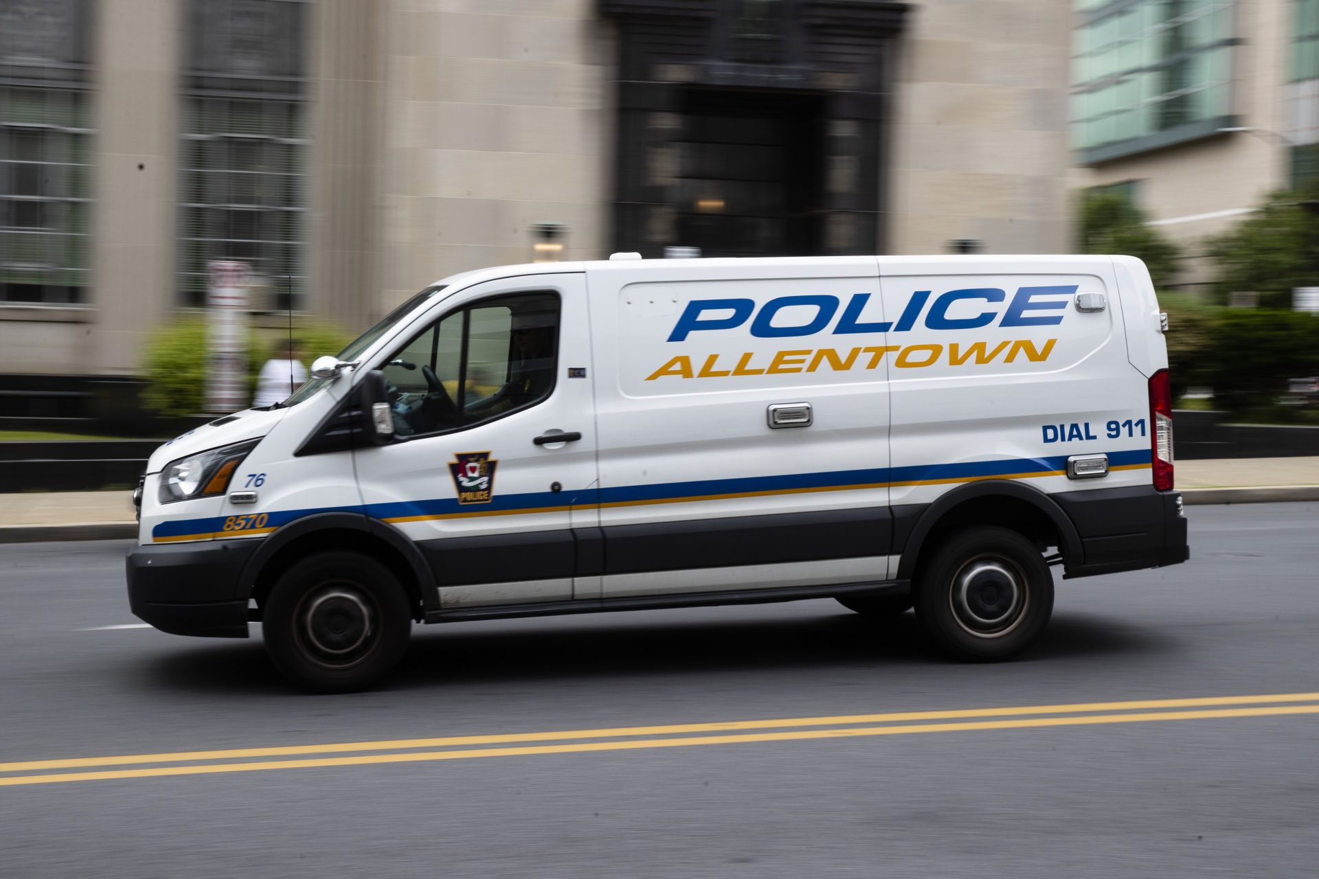 An Allentown, Pa., police van is driven near City Hall on Friday, May 29, 2020. The city furloughed as many as 87 people out of a work force of 783, and all city department chiefs were ordered to slice another 7% from their budgets, including for police, fire and emergency medical services.