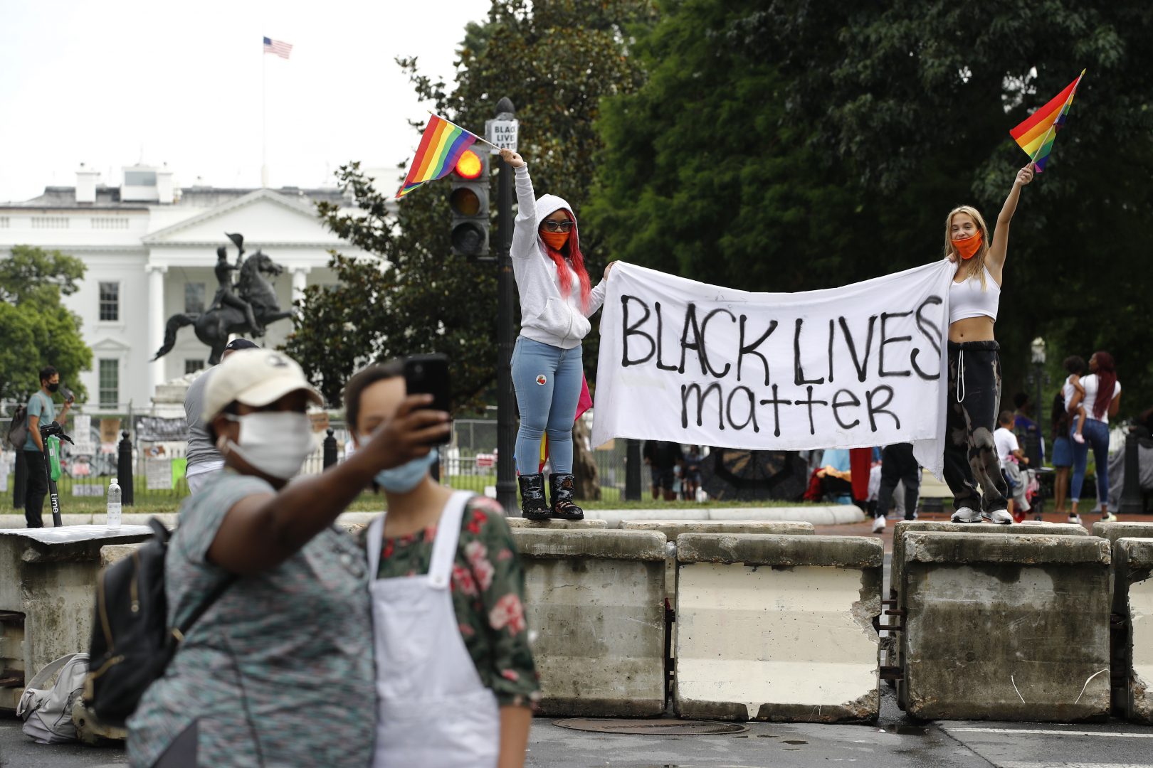 Protesters gather on a part of 16th Street Northwest renamed Black Lives Matter Plaza near the White House in Washington, Saturday, June 20, 2020.