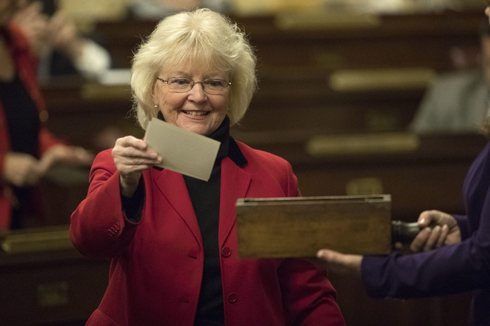 Elector Tina Pickett casts her ballot during Pennsylvania's 58th Electoral College at the state Capitol in Harrisburg, Pa., Monday, Dec. 19, 2016. 