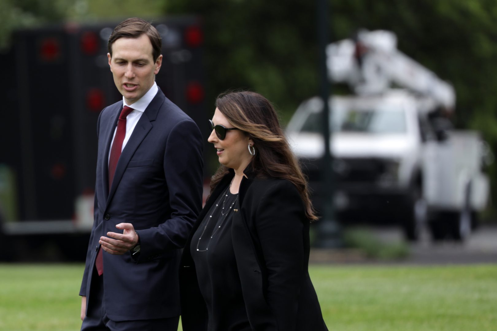 Republican National Committee Chair Ronna McDaniel walks with White House senior adviser Jared Kushner on the South Lawn of the White House in May. She is describing the August convention as a 