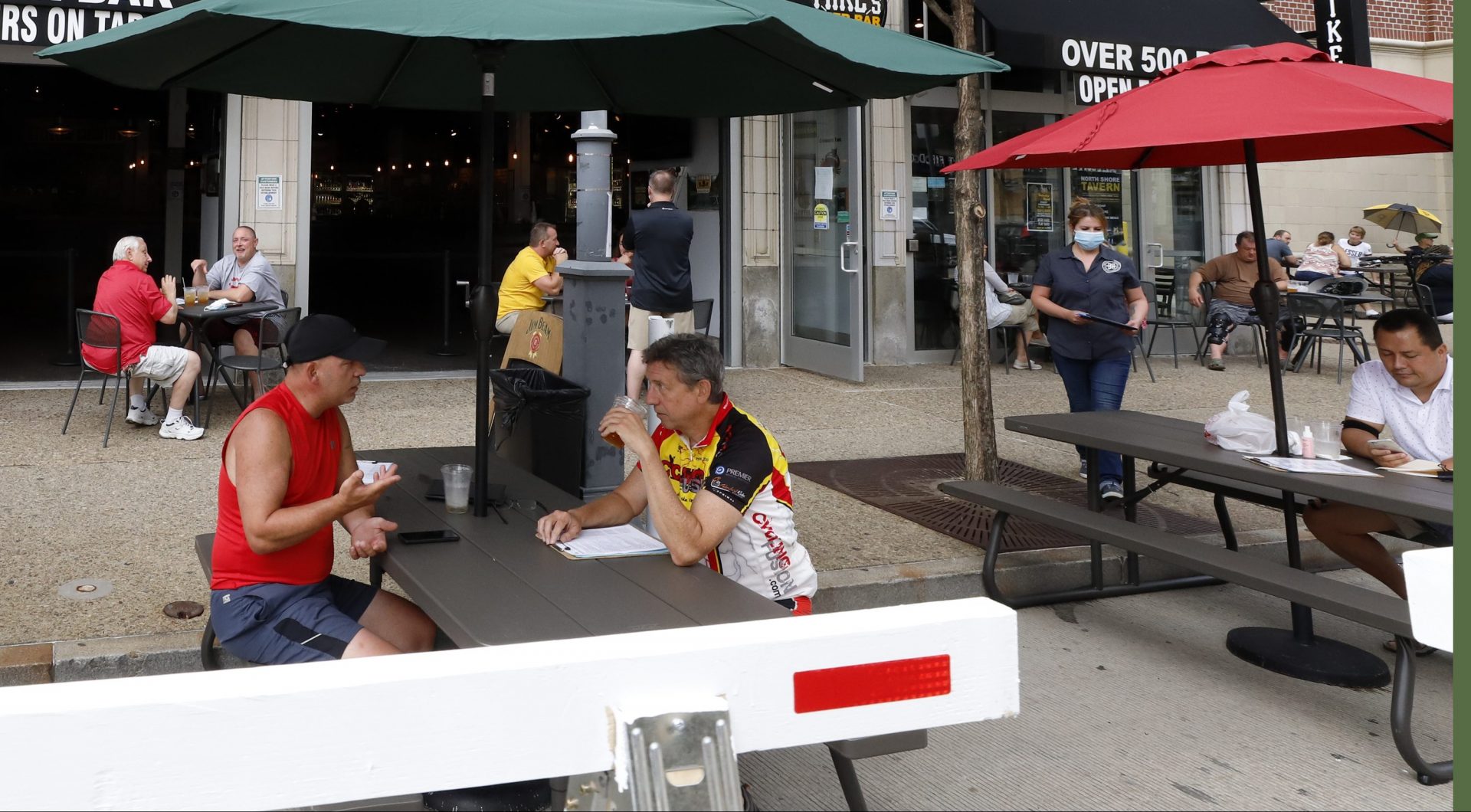 Additional outdoor seating extends into the street outside of Mike's Beer Bar on the Northside of Pittsburgh on Sunday July 12, 2020. With indoor service not permitted due to COVID-19, the expanded outdoor seating at restaurants throughout Pittsburgh will run through mid-to-late October.