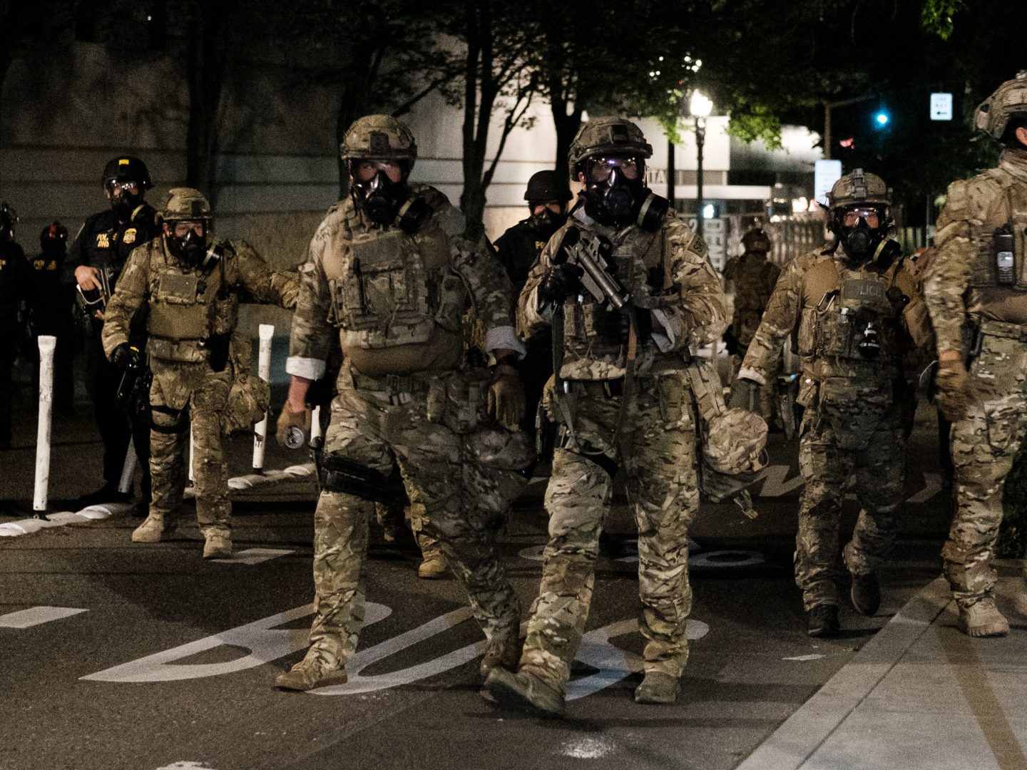 Federal officers prepare to disperse the crowd of protesters outside the Multnomah County Justice Center on July 17 in Portland. The use of federal agents has only made a bad situation worse, state and local officials told NPR.