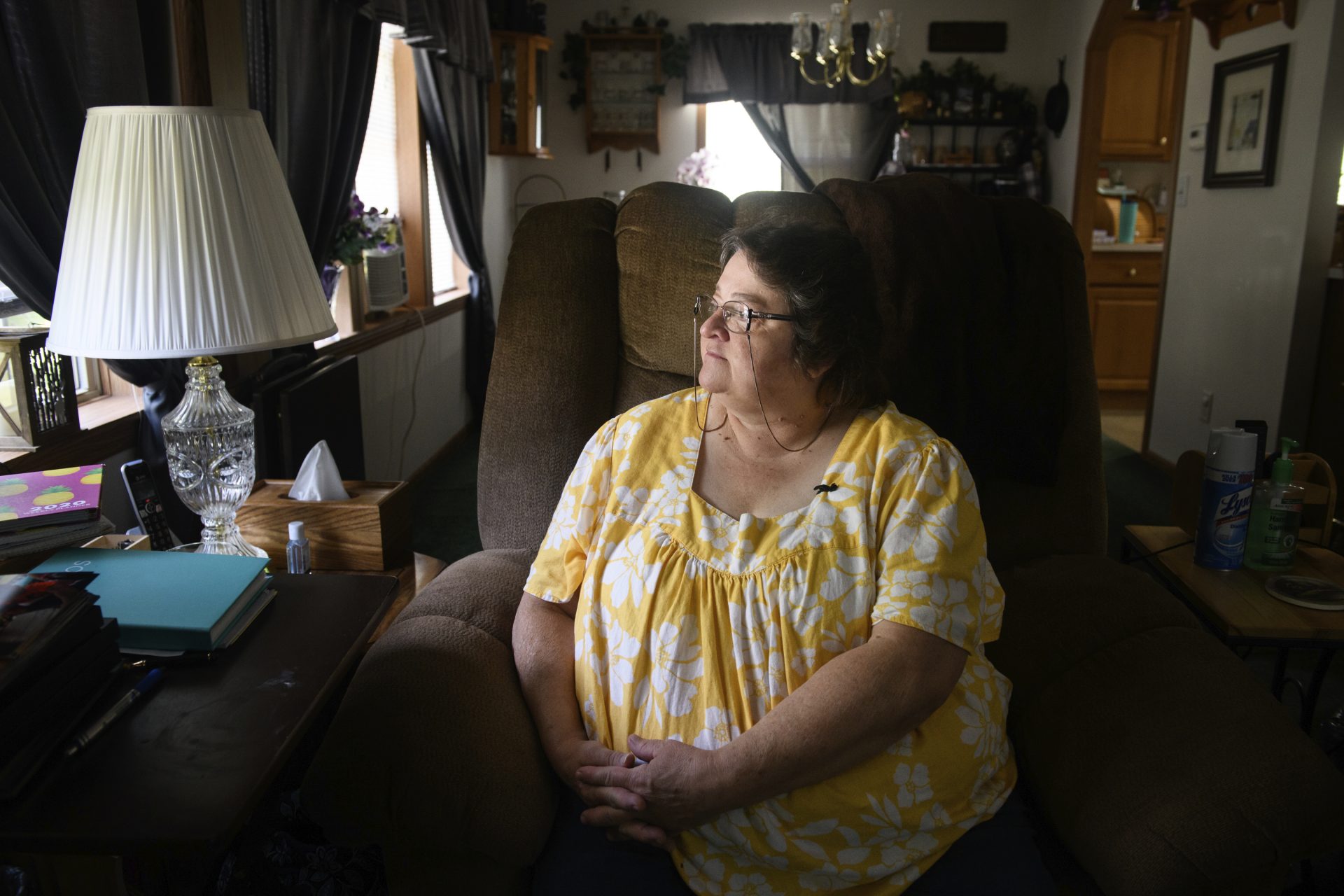 Doris Kelley, 57, sits in her home on Monday, June 29, 2020 in Ruffs Dale, Pa. Kelley was one of the first patients in a UPMC trial for COVID-19.