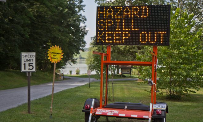 A sign warns visitors to Marsh Creek Lake at the entrance of Marsh Creek Lake State Park in Chester County, Pa., where about 8,000 gallons of drilling mud spilled due to construction of the Mariner East pipeline. 