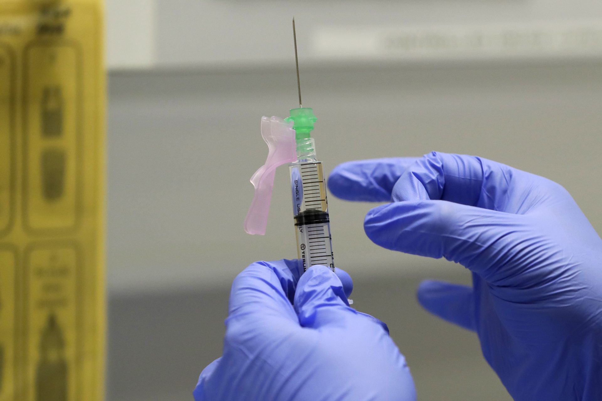 Senior Clinical Research Nurse Ajithkumar Sukumaran prepares the COVID 19 vaccine to administer to a volunteer, at a clinic in London, Wednesday, Aug. 5, 2020. Scientists at Imperial College London are immunizing hundreds of people with an experimental coronavirus vaccine in an early trial after seeing no worrying safety problems in a small number vaccinated so far.