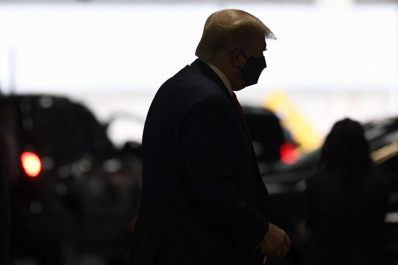 President Donald Trump steps out of his vehicle with a face mask on in New York, Friday, Aug. 14, 2020, on his way to visit with his younger brother, Robert Trump, who has been hospitalized in New York. (AP Photo/Susan Walsh)