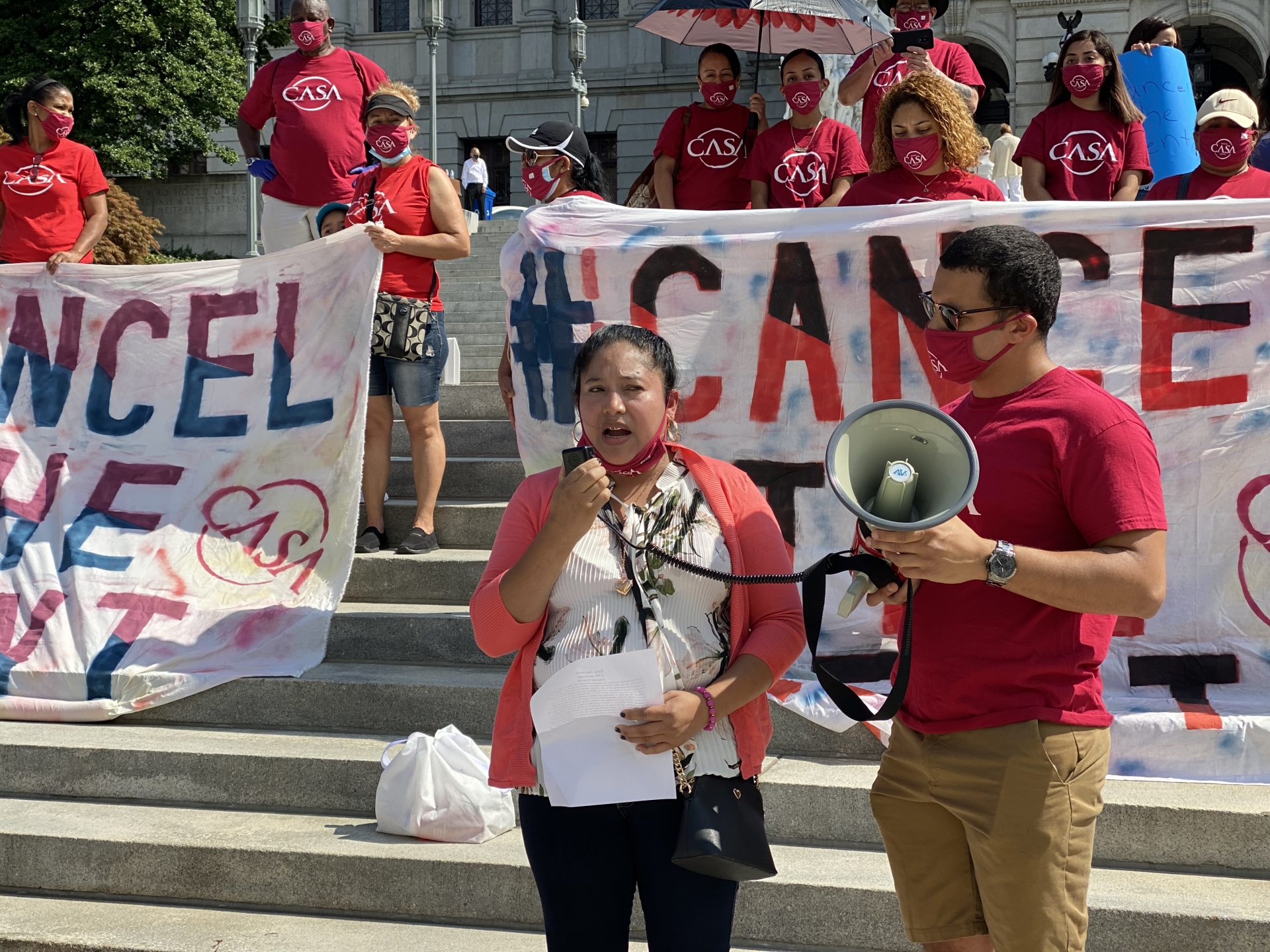 Elvia Gonzalez shared her story about losing work, contracting the coronavirus and struggling to pay rent during the pandemic Wednesday on the Capitol building steps. (Anthony Orozco/WITF)