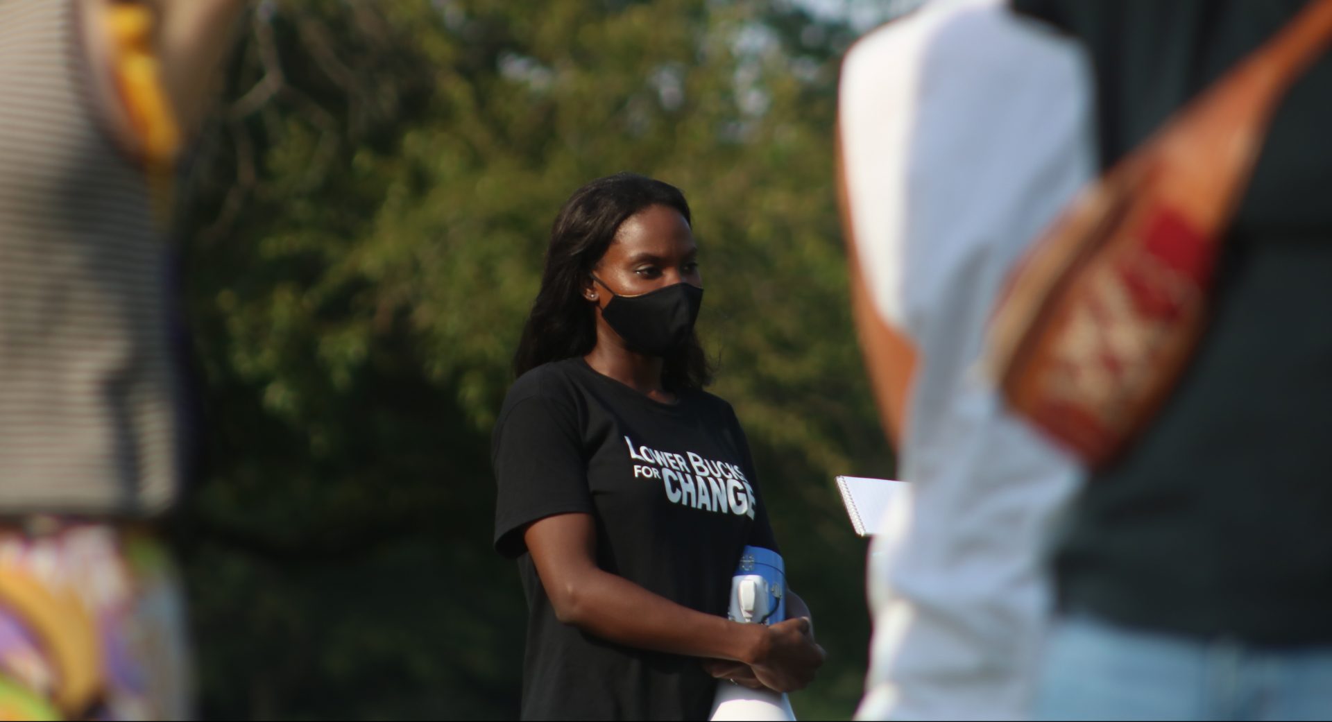 Romy Ulysse, whose brother has schizophrenia, holds a megaphone at a protest outside Lower Bucks Hospital on Aug. 21, 2020. (Courtesy of Tom Sofield/LevittownNow.com)