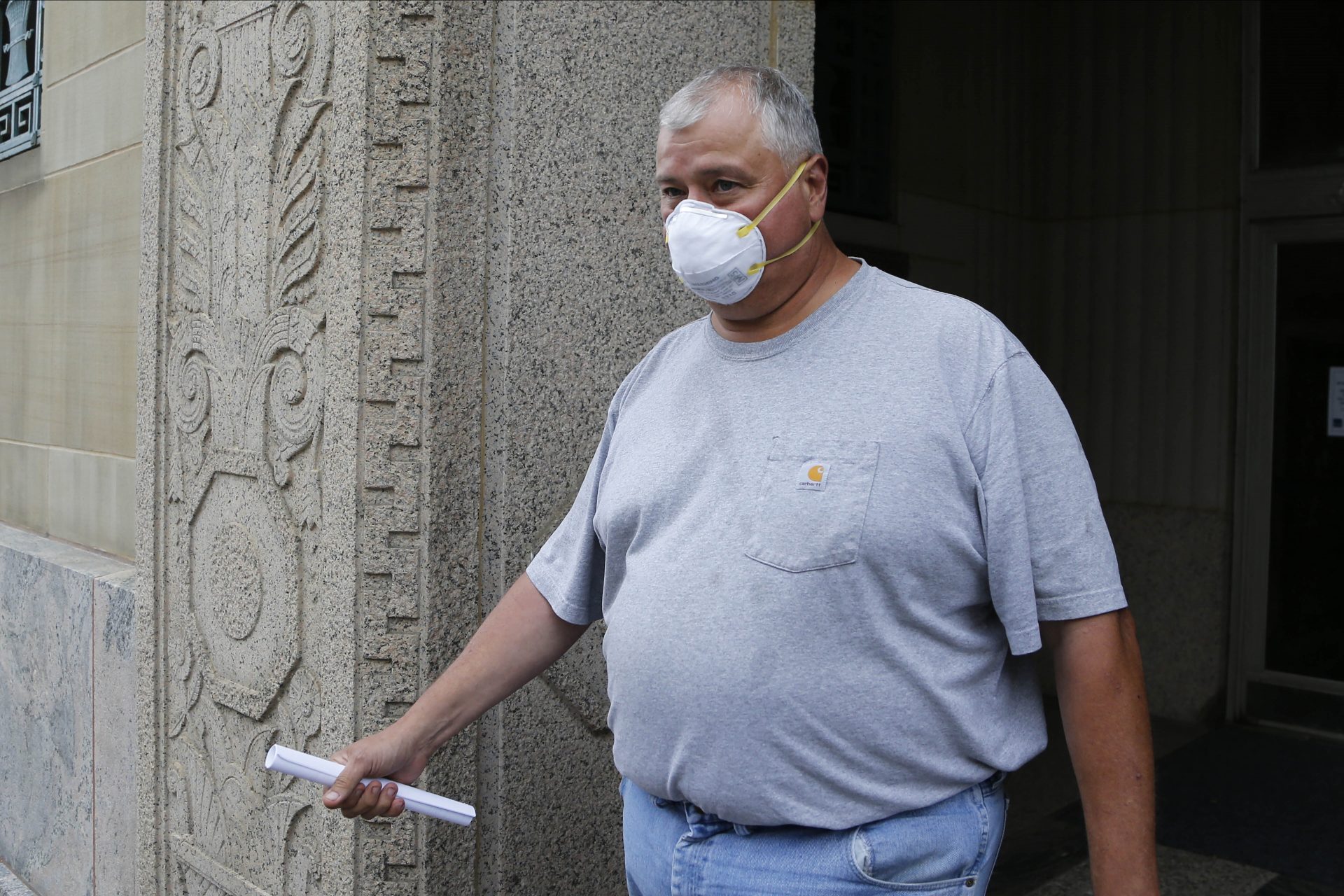 This July 21, 2020 file photo shows former Ohio House Speaker Larry Householder leaving the federal courthouse after an initial hearing following charges against him and four others alleging a $60 million bribery scheme, in Columbus, Ohio. A court hearing is set for Thursday, Aug. 6, 2020 for five people, including Householder, following their indictment on a racketeering charge.