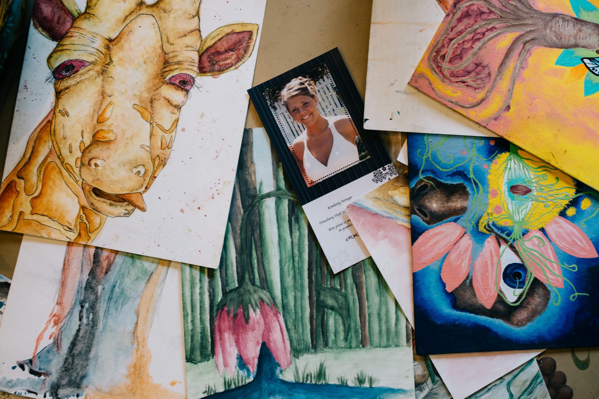 An assortment of Kimberly Stringer's art from when she was in school is displayed at her parents' home on Aug. 7, 2020. Paul and Martha Stringer noted that her art was the only thing Kimberly asked them to keep safe during her treatments.