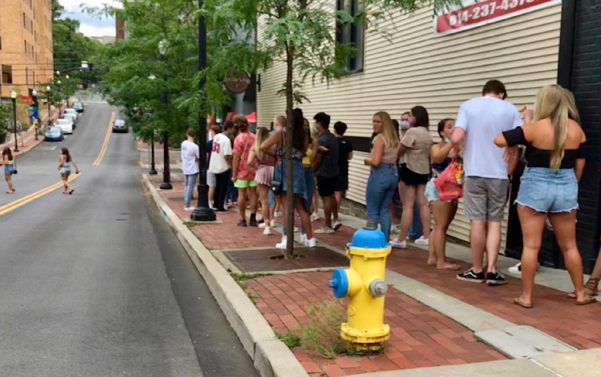 A line outside Doggie's Pub on Pugh Street in State College July 11, 2020.