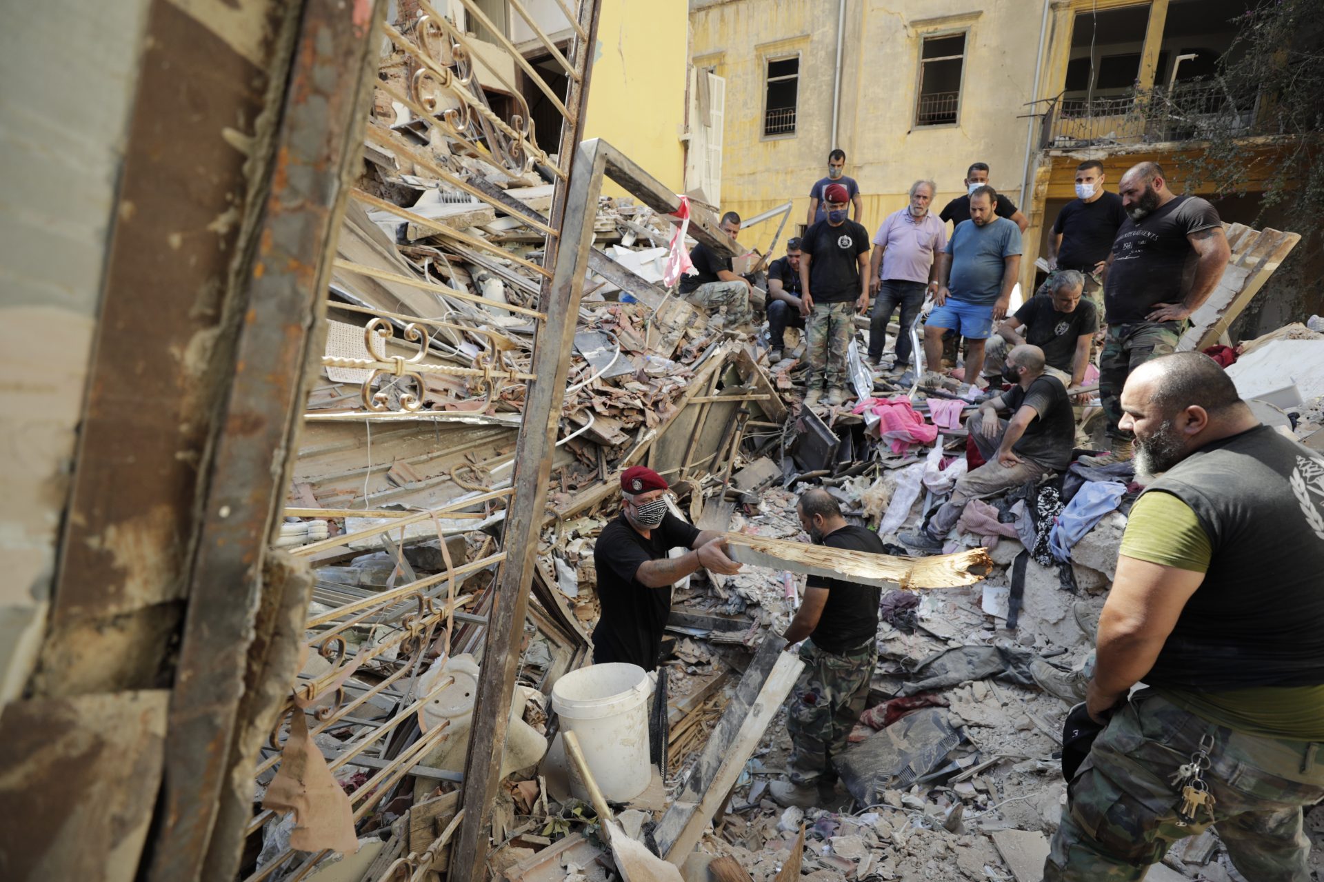 Lebanese soldiers search for survivors on Wednesday, one day after a massive explosion in Beirut.
