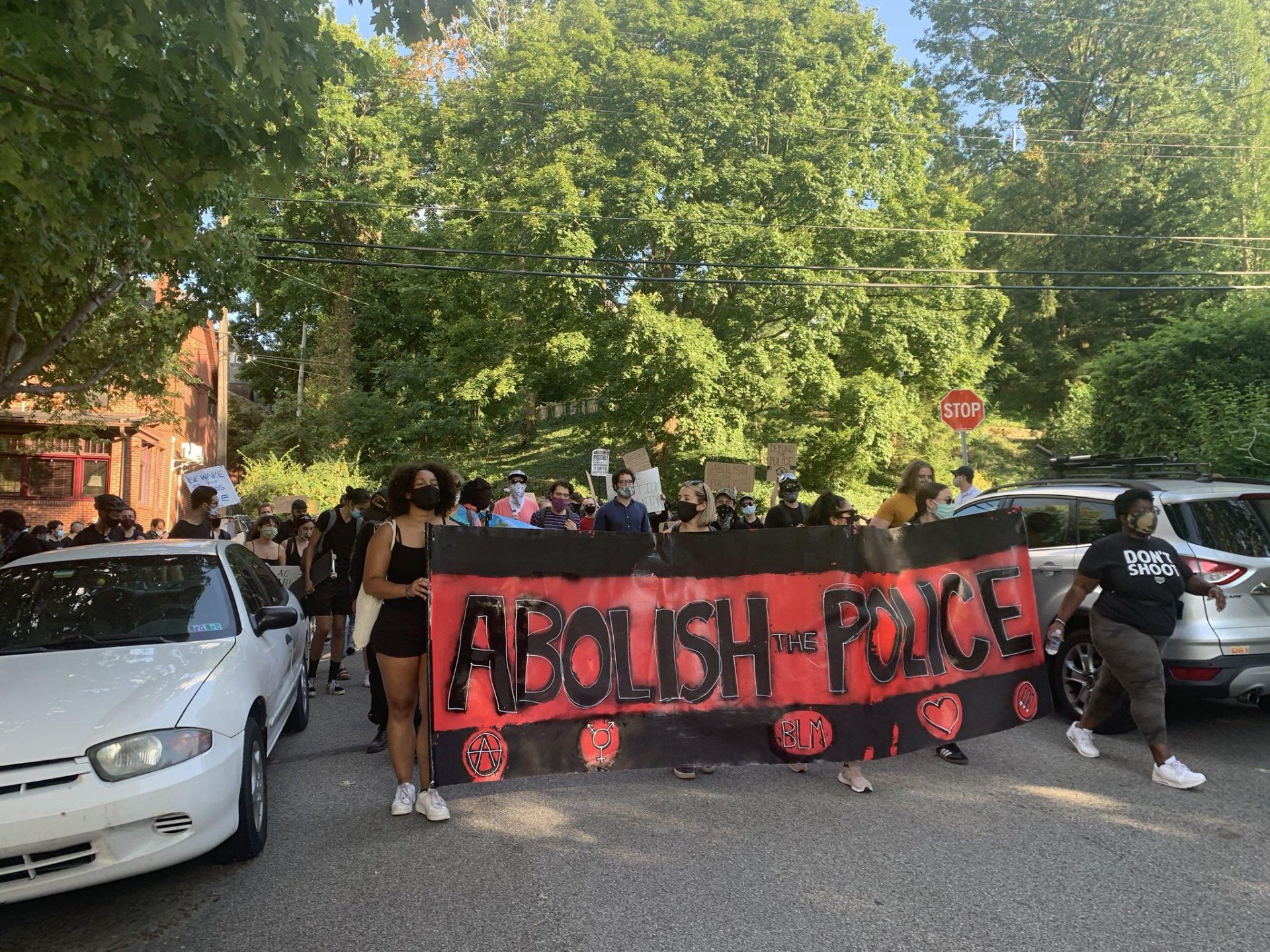 Protesters marched to Pittsburgh Mayor Bill Peduto’s home in Point Breeze Sunday, August 16, a day after city police arrested protest marshal Matthew Cartier.
