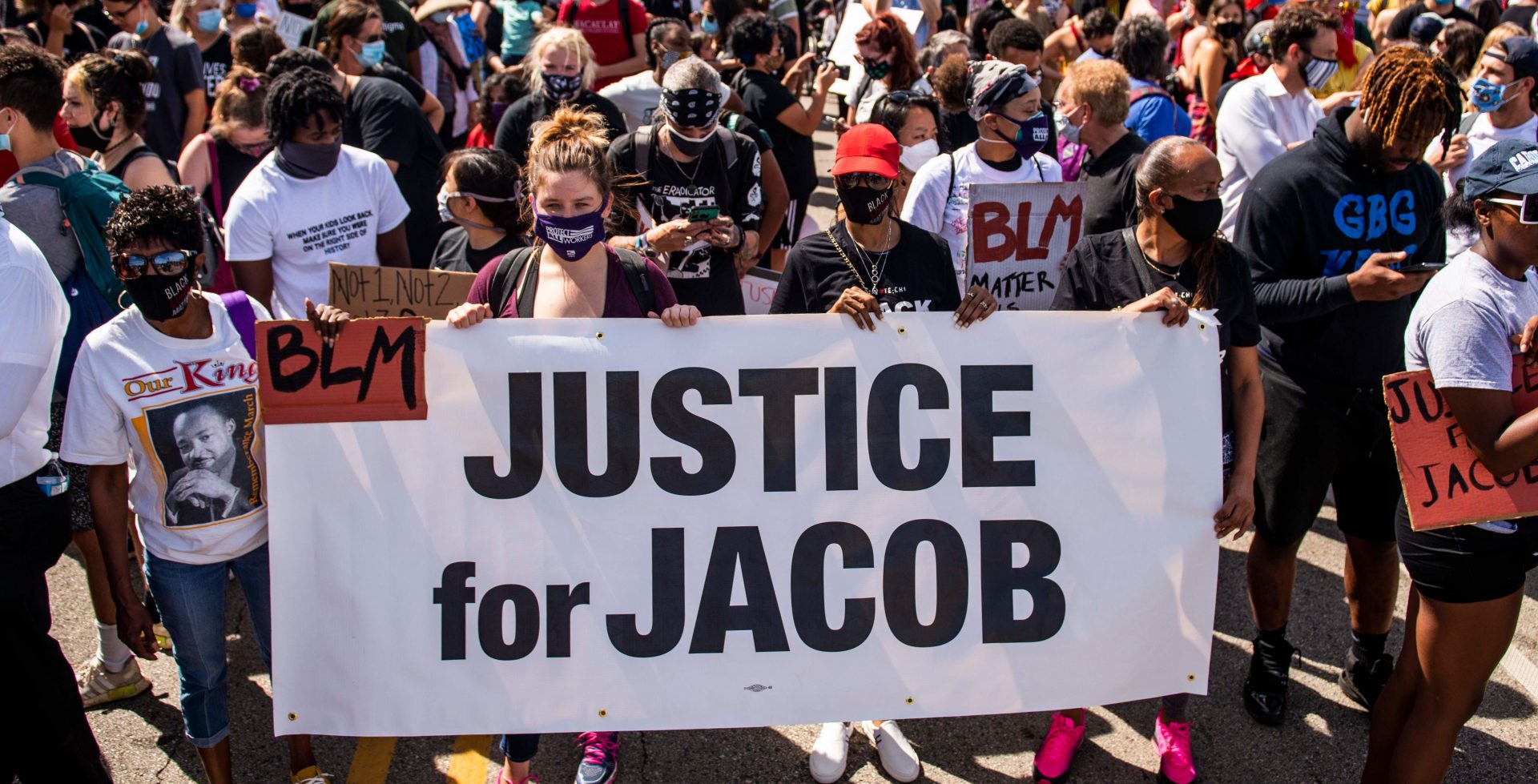 Protesters march with the family of Jacob Blake during a rally against racism and police brutality in Kenosha, Wisconsin, on August 29, 2020.