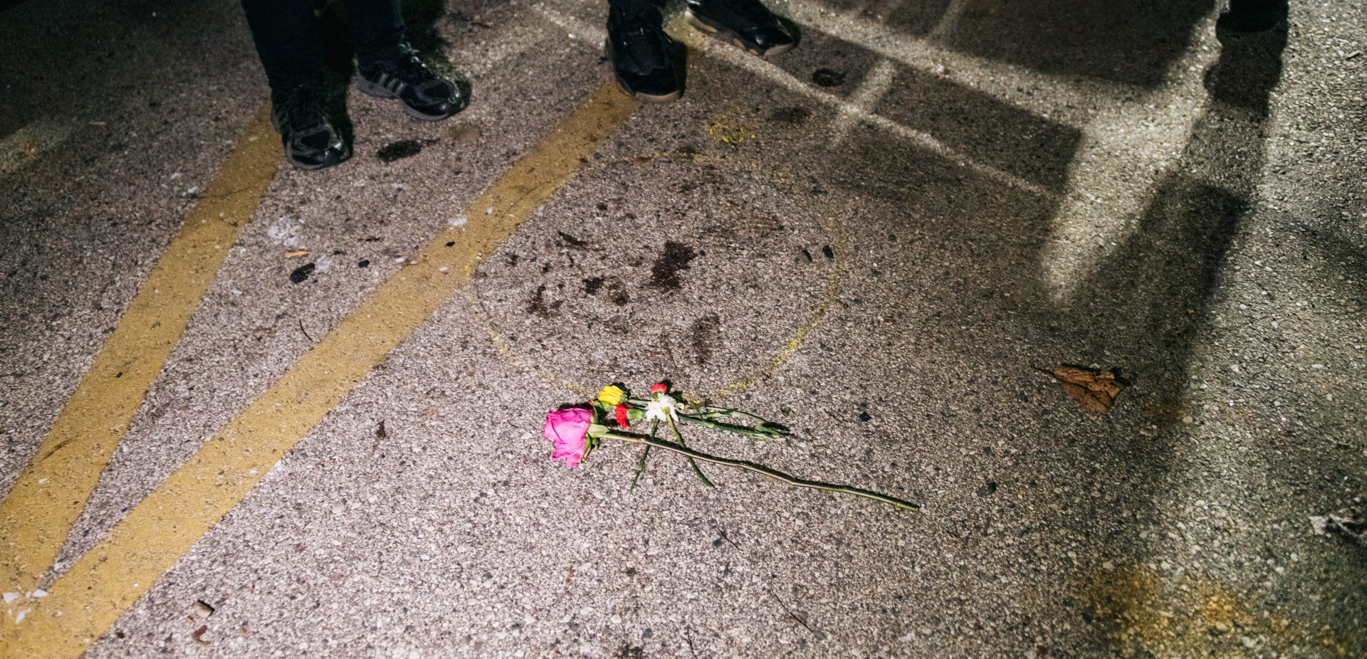 Demonstrators revisit the site where a protester was killed in Kenosha, Wis. On Aug. 25, 17-year-old Kyle Rittenhouse shot and killed two protesters. He was charged on Thursday with six criminal counts, including first-degree intentional homicide.