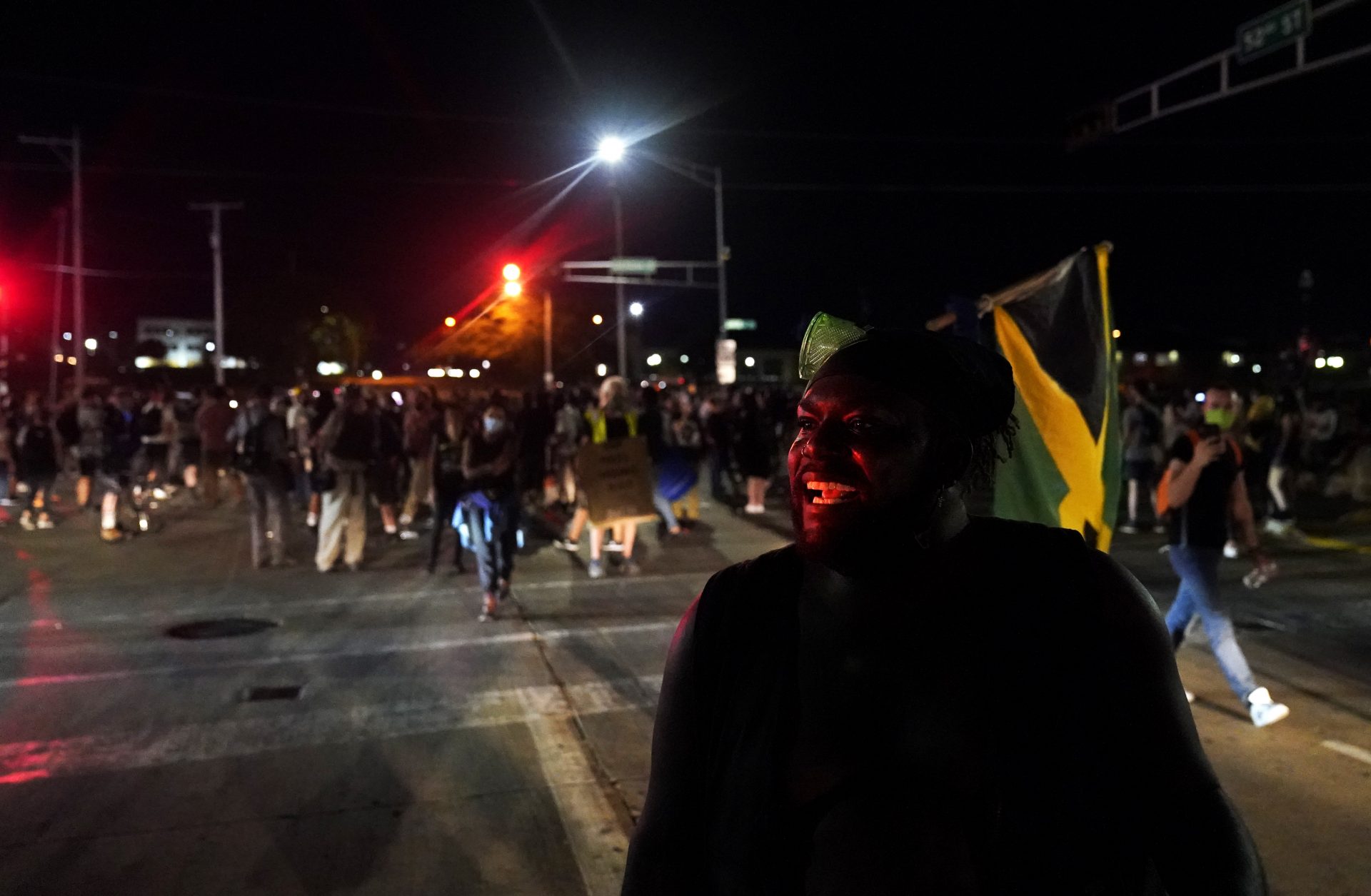 Oscar Walton speaks to fellow protesters while marching against the police shooting of Jacob Blake in Kenosha, Wis., Wednesday, Aug. 26, 2020.