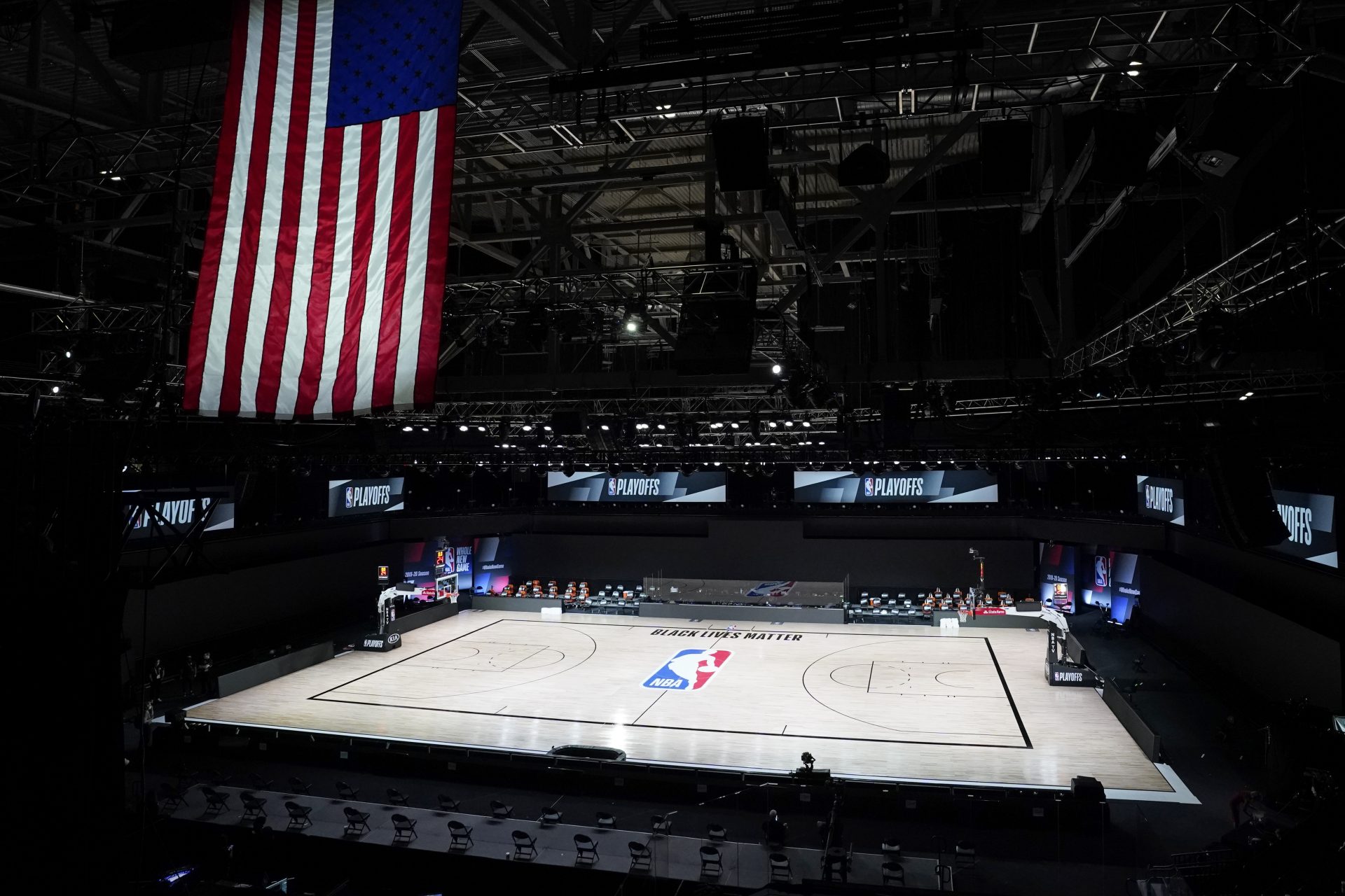The court sits empty after a postponed NBA basketball first round playoff game between the Milwaukee Bucks and the Orlando Magic, Wednesday, Aug. 26, 2020, in Lake Buena Vista, Fla. The game was postponed after the Milwaukee Bucks didn't take the floor in protest against racial injustice and the shooting of Jacob Blake, a Black man, by police in Kenosha, Wisconsin.