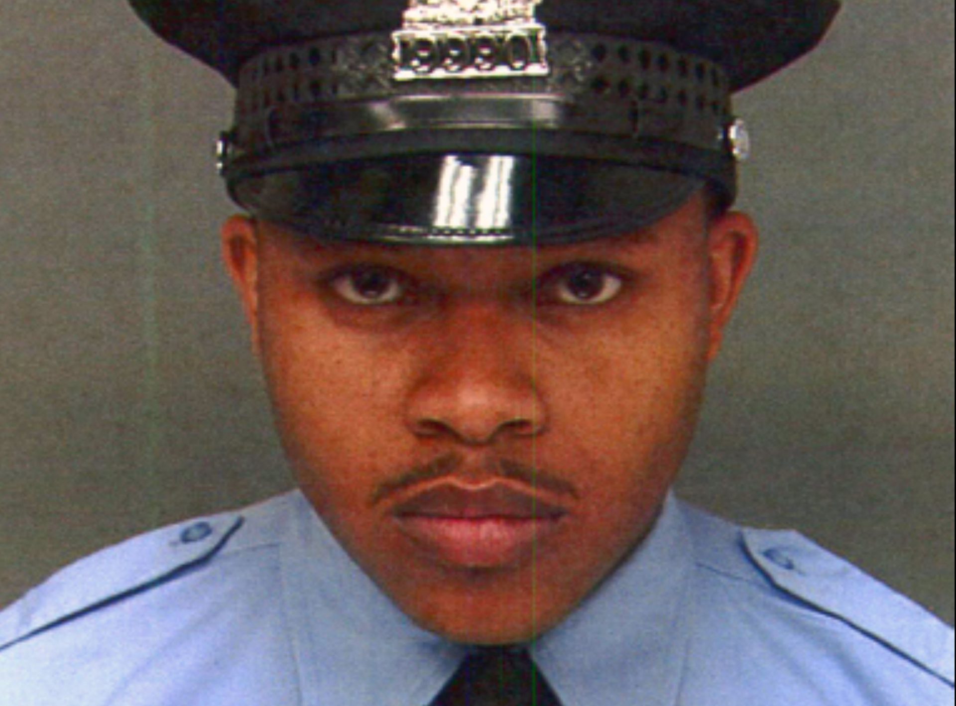 This undated photo provided by Philadelphia Police Department, shows Robert Wilson III. Wilson, a Philadelphia police officer, was shot in the head and killed after he and his partner exchanged gunfire with two suspects trying to rob a video game store, city officials said Thursday, March 5, 2015.