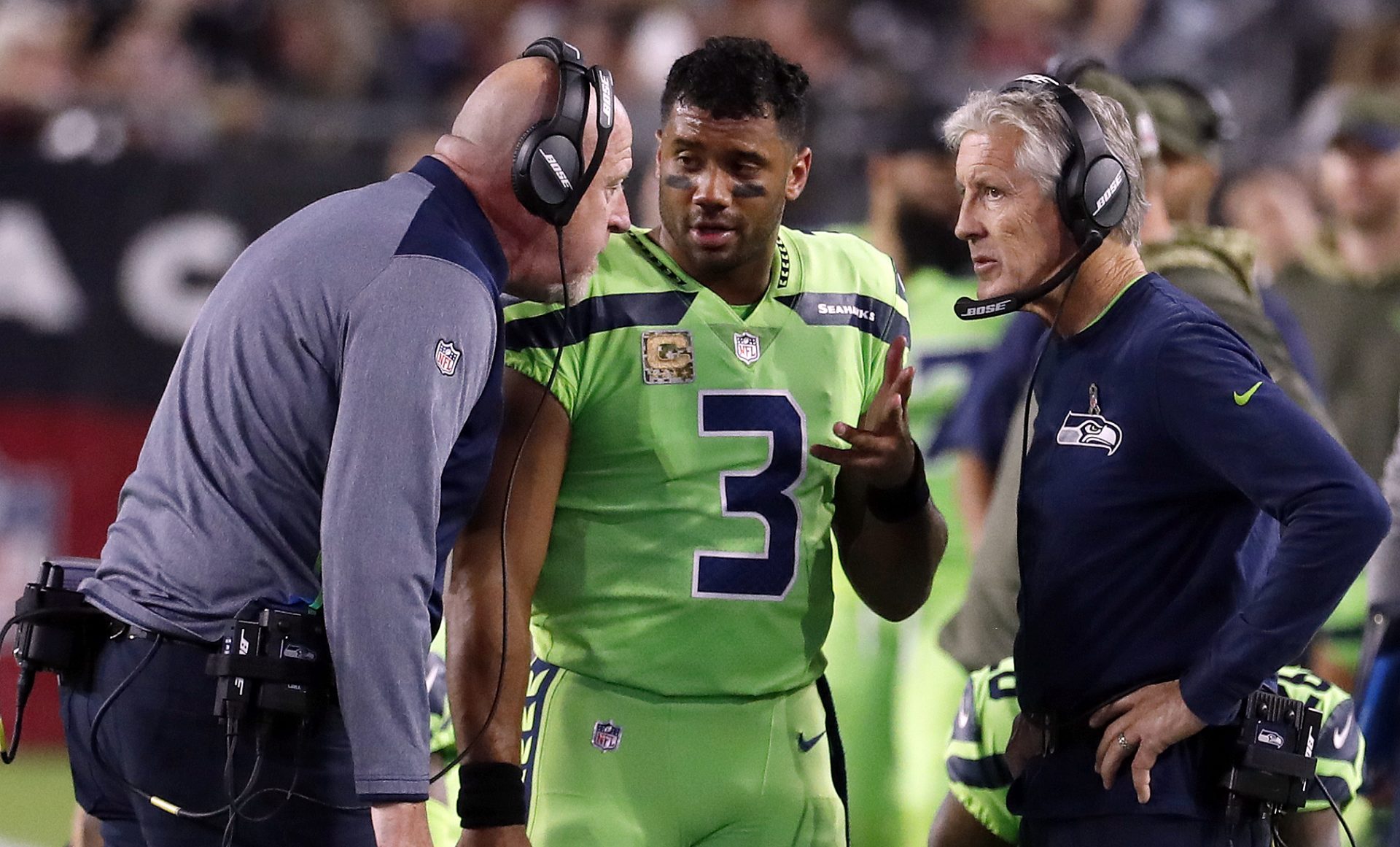FILE - In this Thursday, Nov. 9, 2017, file photo, Seattle Seahawks quarterback Russell Wilson (3) speaks with head coach Pete Carroll, right, and assistant head coach Tom Cable during an NFL football game against the Arizona Cardinals in Glendale, Ariz. The Seahawks return to practice Tuesday, Nov. 14, 2017, without Richard Sherman and facing questions about how the team handled the concussion protocol with quarterback Russell Wilson.