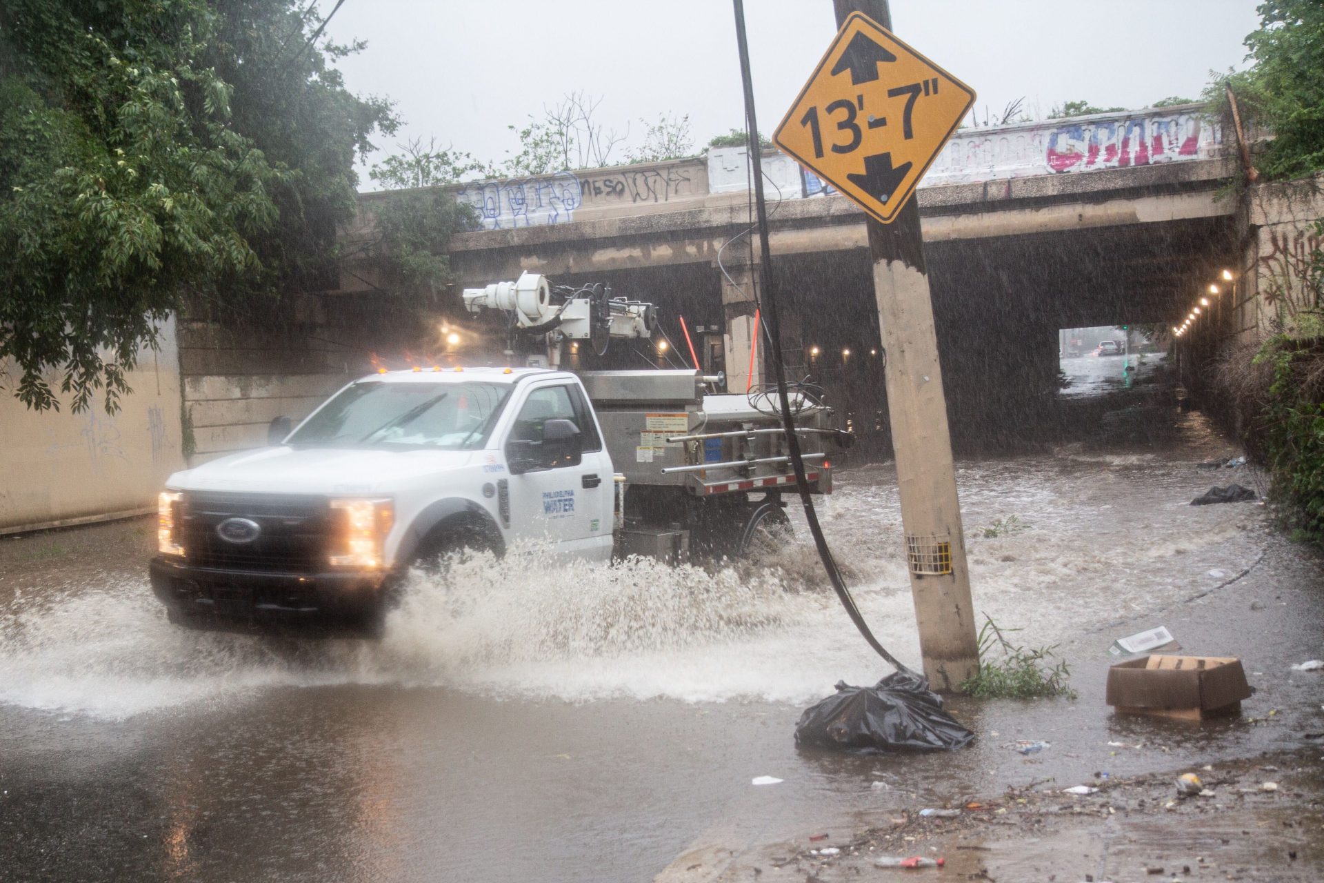 A Philadelphia Water Department Vehicle closes down flooded Tulip and Lehigh streets during Tropical Storm Isaias in Philadelphia.