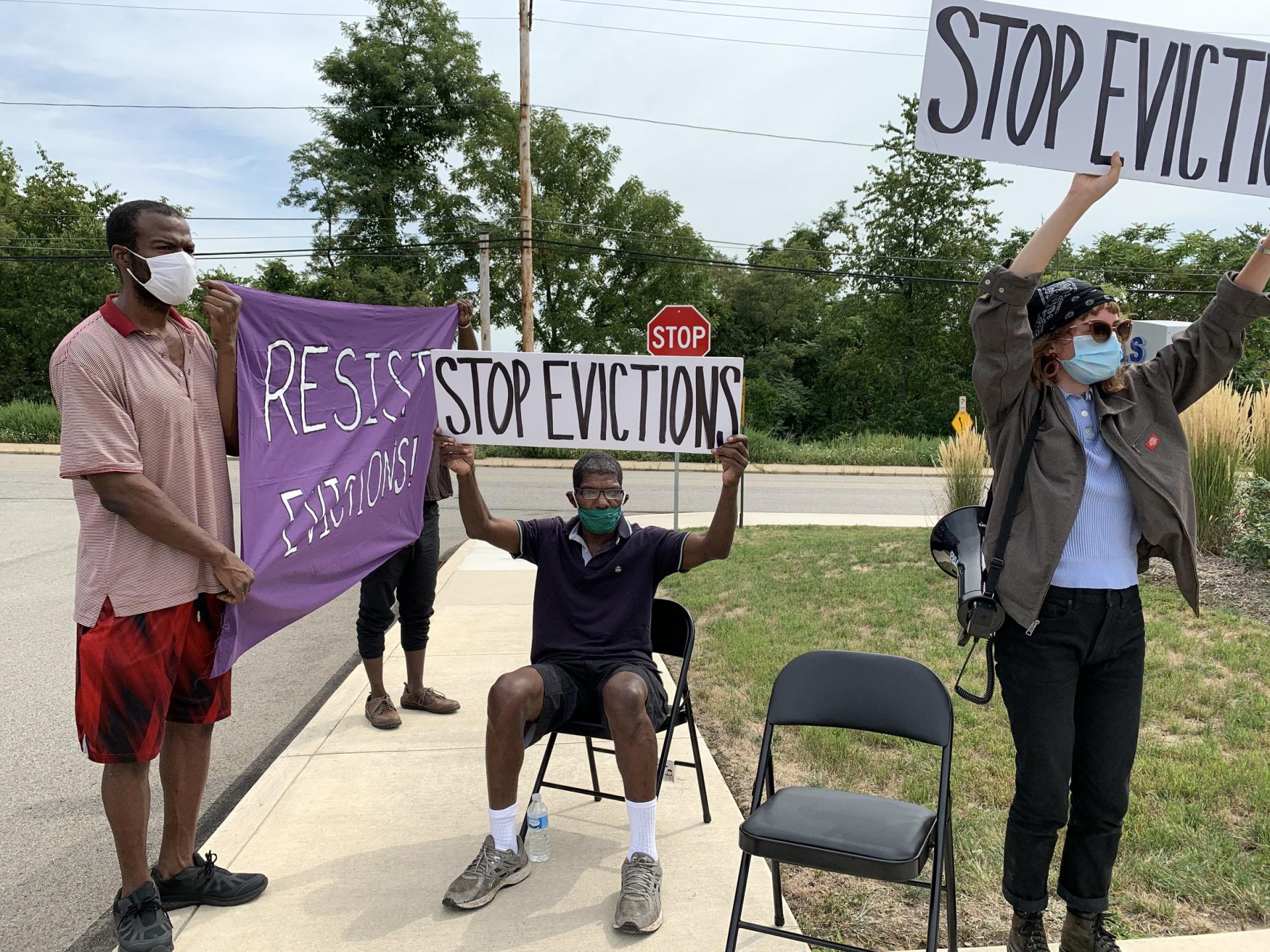 Anthony Straughter (center) protested his impending eviction from the Valmar Gardens apartment complex on Friday, August 21. Valmar Gardens residents organized the rally with the new Pittsburgh chapter of the United Neighborhood Defense Movement.