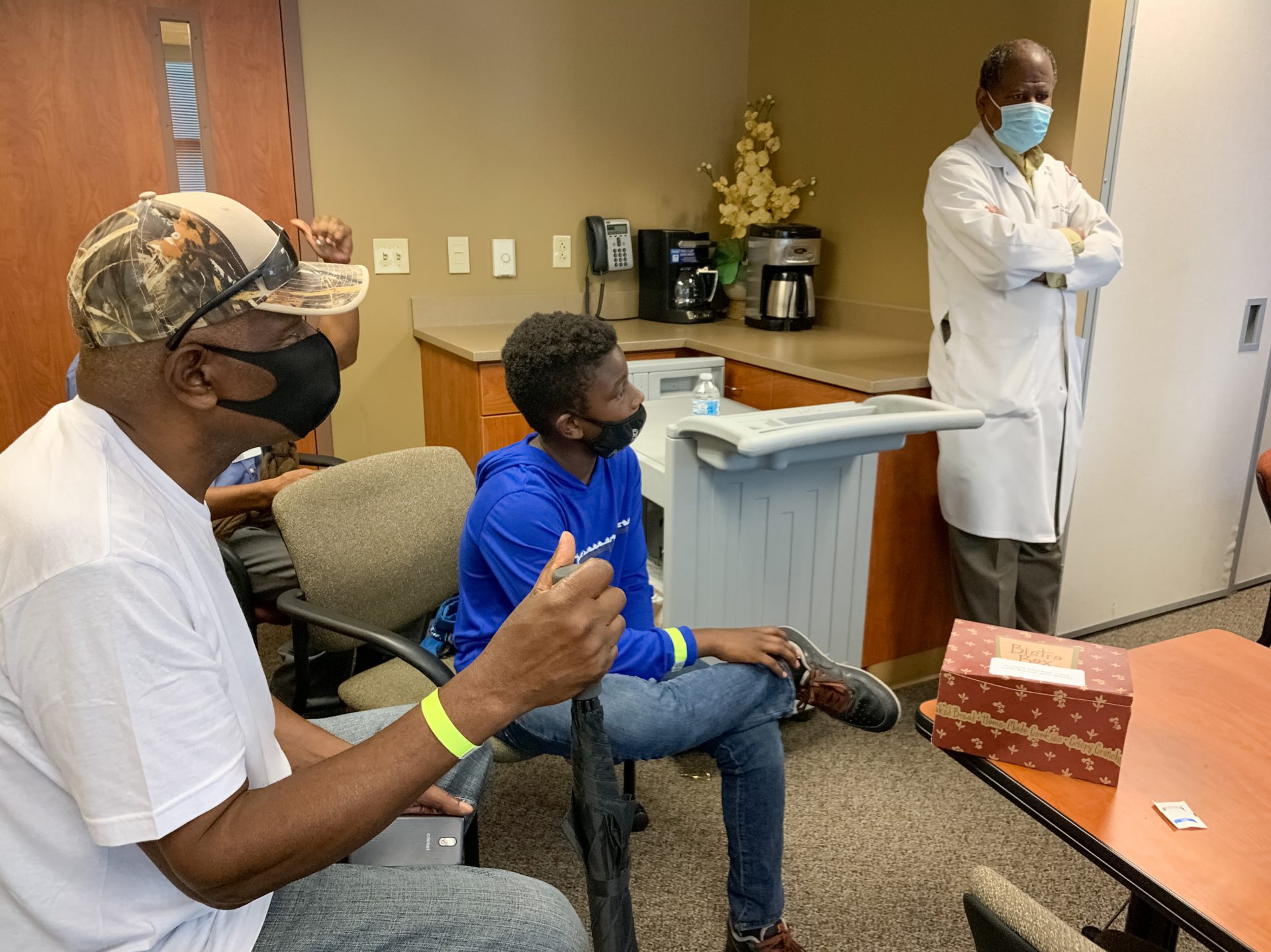 Robert Smith of Nashville listens to his long-time physician, Dr. Vladimir Berthaud of Meharry Medical College, explain the importance of Black patients participating in clinical trials for the COVID-19 vaccine. Berthaud is leading the site hosted at the historically black medical school.