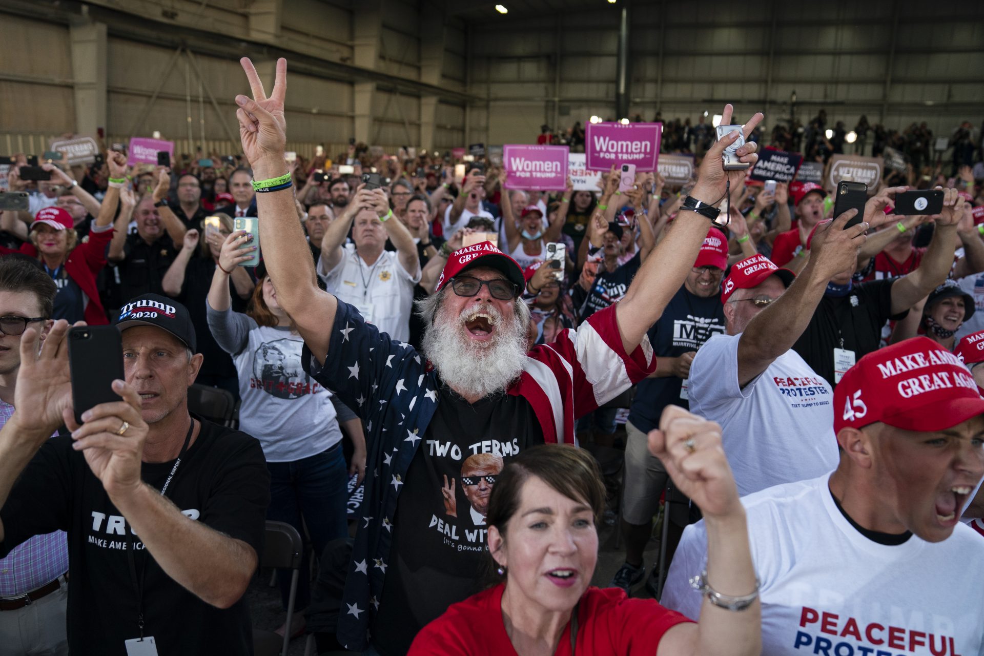 Supporters of President Donald Trump cheer as he arrives to speak during a campaign rally at Arnold Palmer Regional Airport, Thursday, Sept. 3, 2020, in Latrobe, Pa.