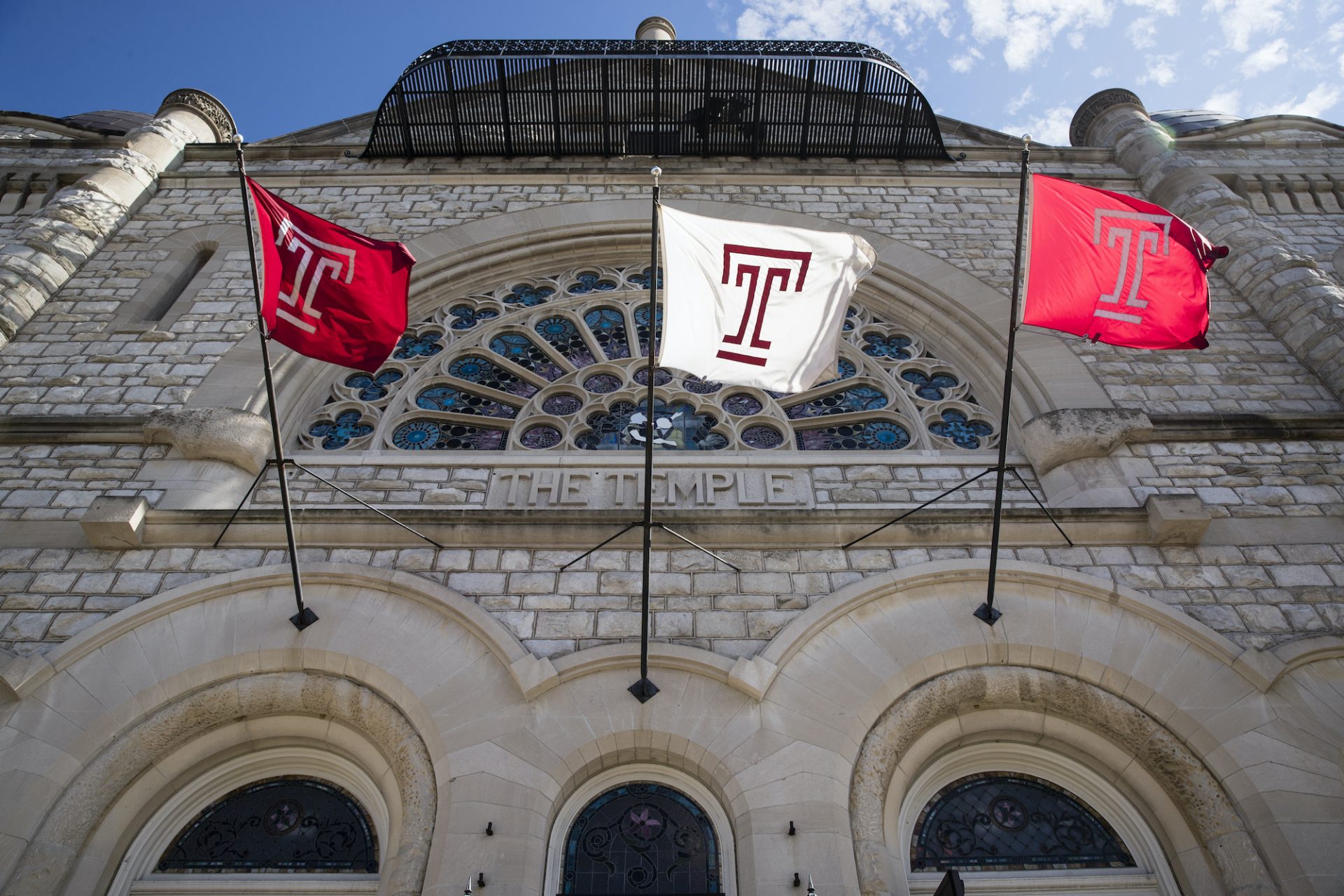FILE PHOTO: Flags wave in the wind from a building on the at Temple University campus in Philadelphia, Tuesday, Oct. 10, 2017.