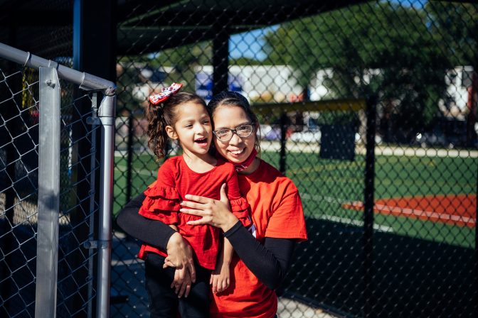 Lourdes Garcia-Franqui and her daughter commemorate the third anniversary of Hurricane María in Roberto Clemente Park in Lancaster. (Dani Fresh/WHYY)