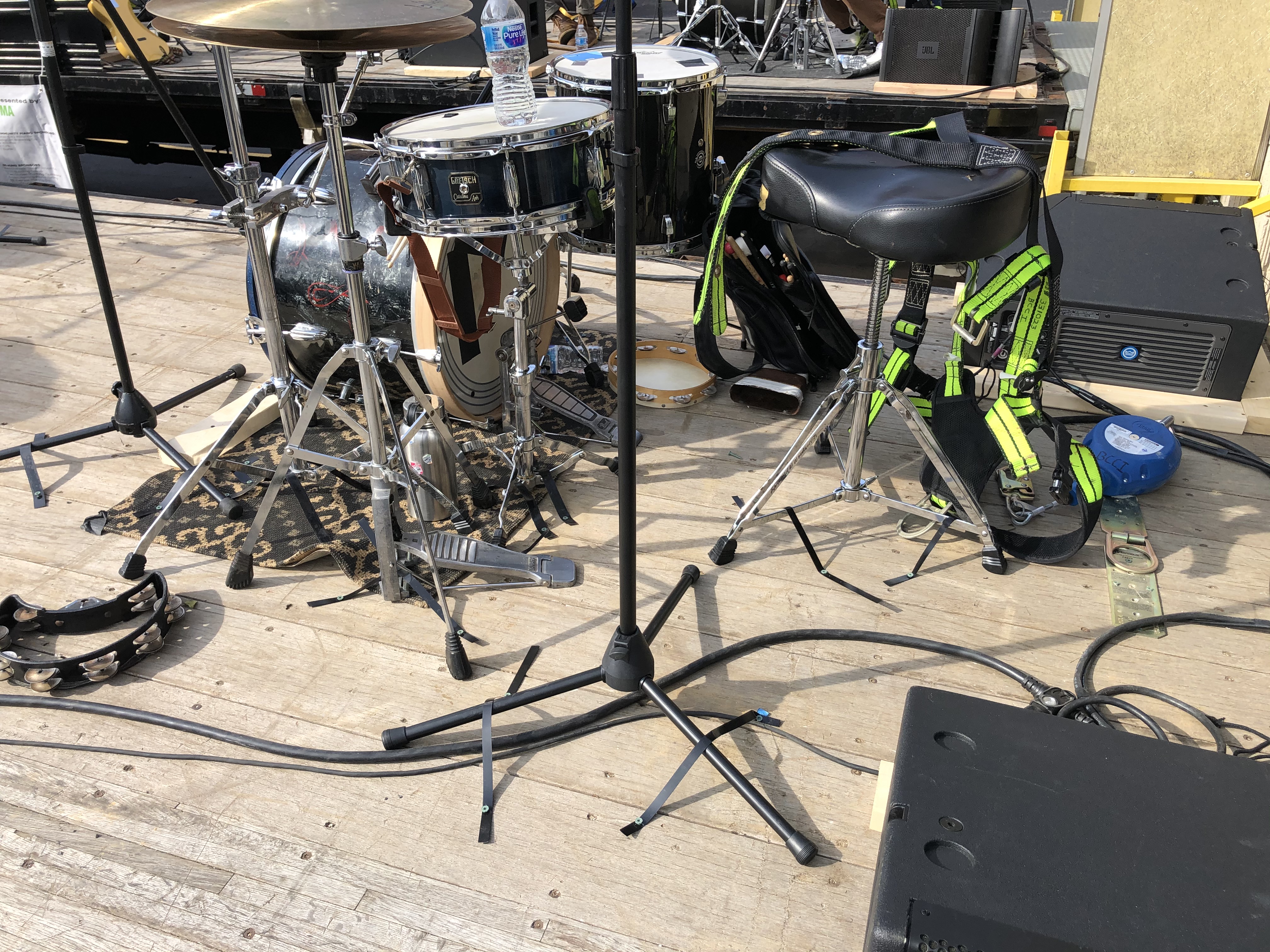 Music stands and gear strapped onto a flabed truck.