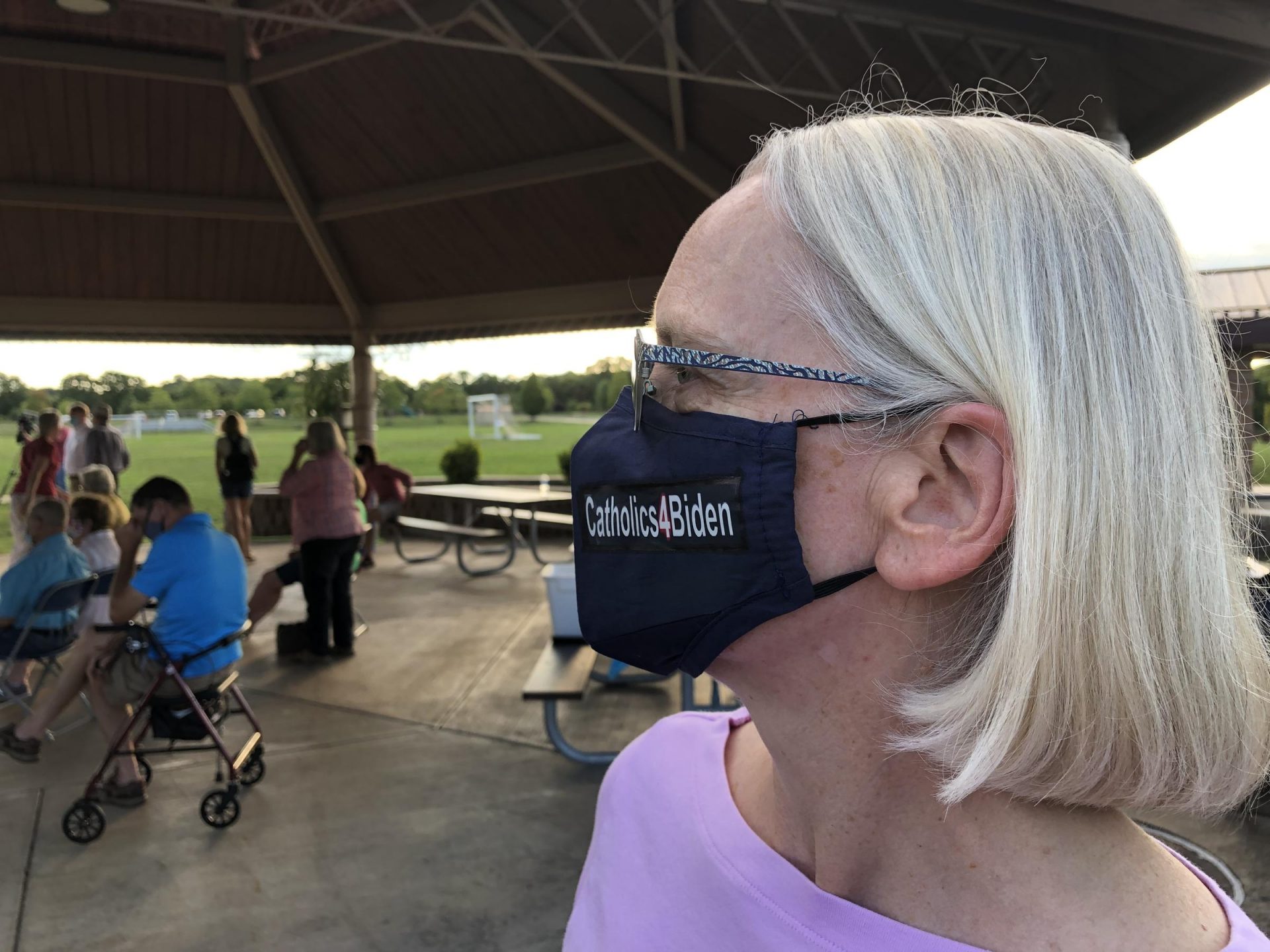 Independent voter Betsy Cwenar wears a Catholics4Biden face mask.