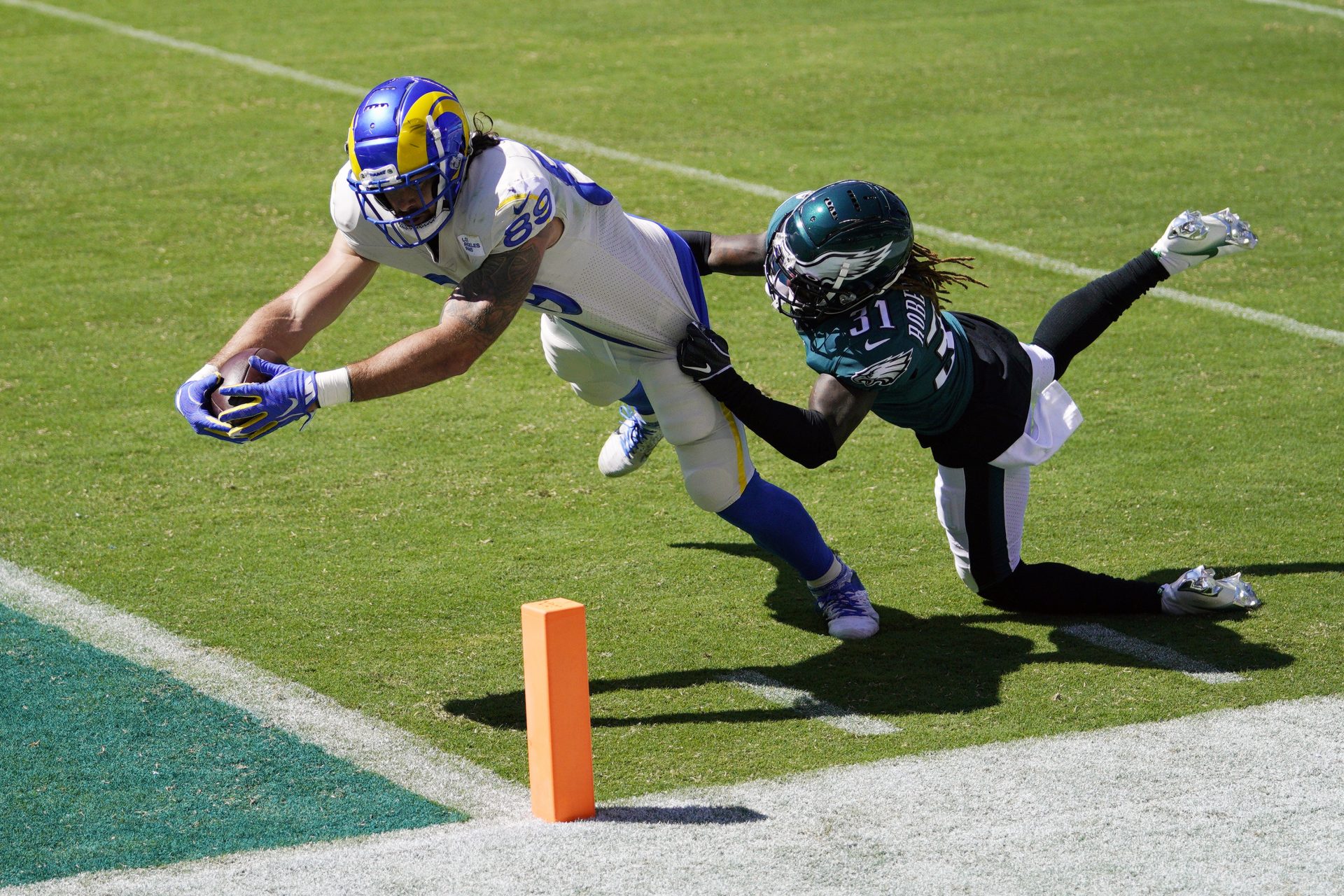 Los Angeles Rams' Tyler Higbee, left, reaches for a touchdown against Philadelphia Eagles' Nickell Robey-Coleman during the first half of an NFL football game, Sunday, Sept. 20, 2020, in Philadelphia.