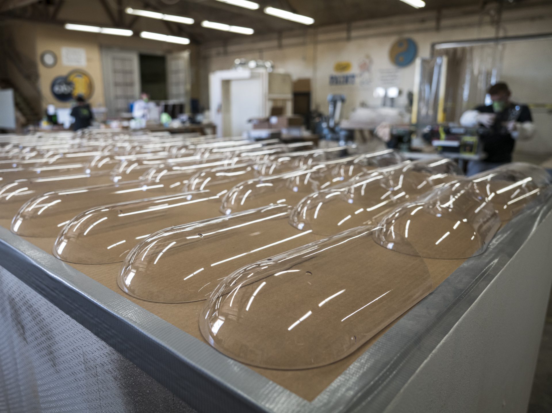 Plastic face shields sit on a table at Mask & Shield, a division of Monster City Studios, in Fresno, Calif., on May 27.