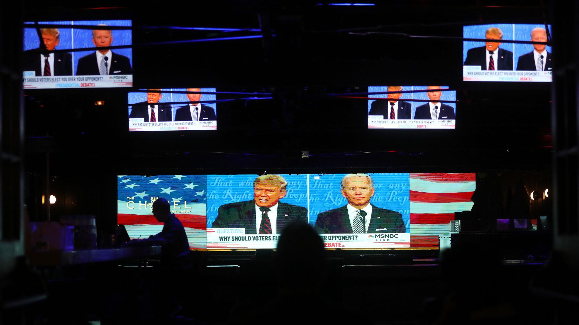 WEST HOLLYWOOD, CALIFORNIA - SEPTEMBER 29: A broadcast of the first debate between President Donald Trump and Democratic presidential nominee Joe Biden is played on indoor TV's at The Abbey, which seated patrons at socially distanced outdoor tables, on September 29, 2020 in West Hollywood, California. The debate being held in Cleveland, Ohio is the first of three scheduled debates between Trump and Biden. (Photo by Mario Tama/Getty Images)