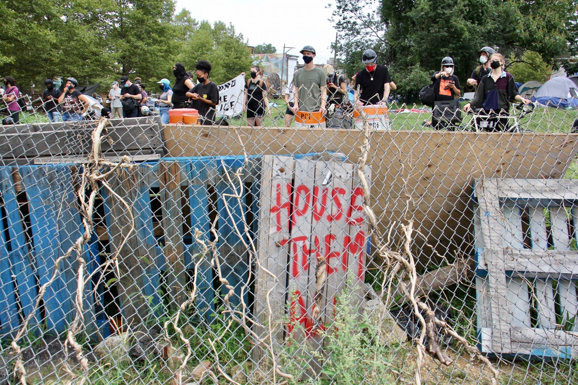 Protesters defend a homeless encampment on Ridge Avenue. 
