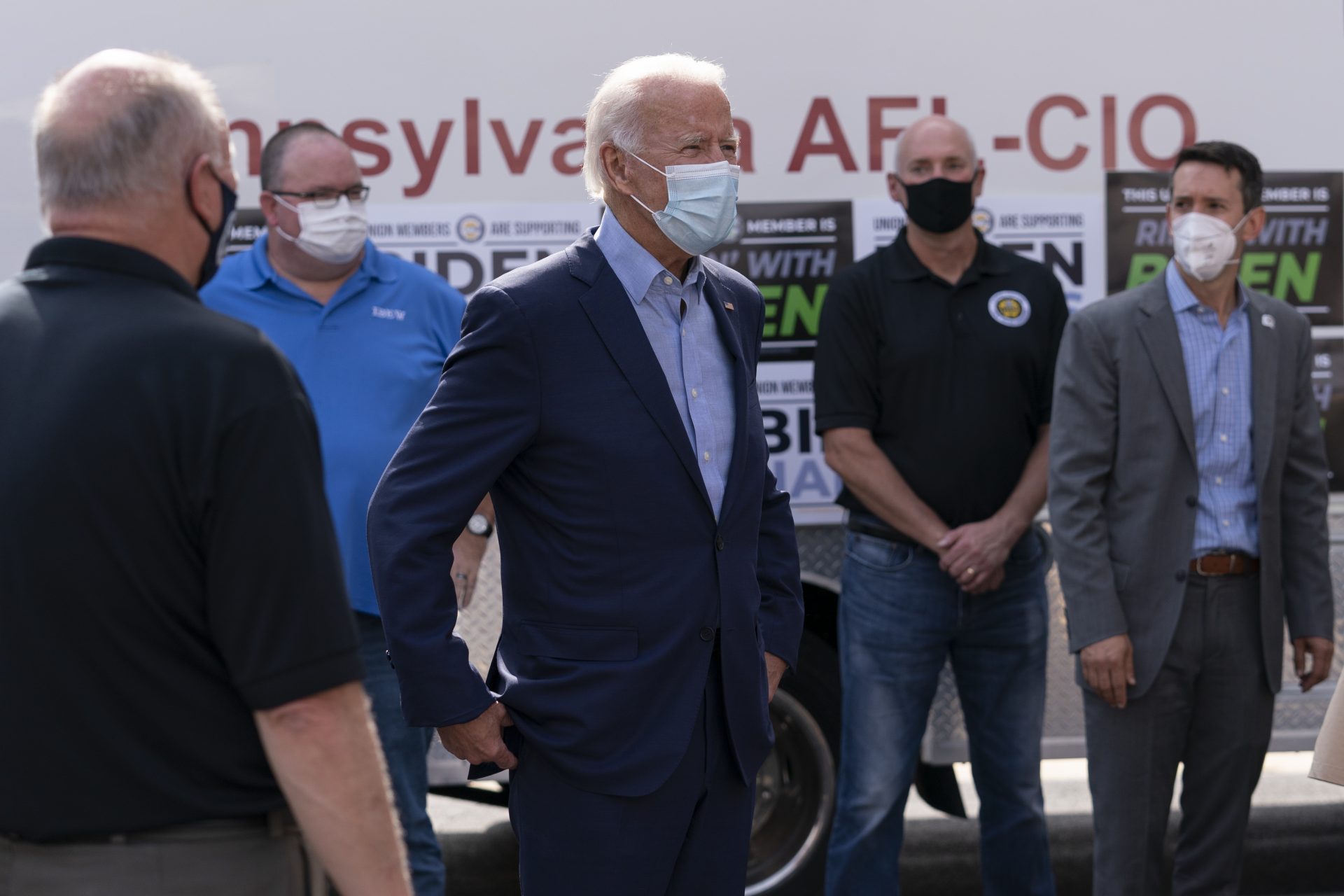 Democratic presidential candidate former Vice President Joe Biden talks with union leaders after taking photographs outside the AFL-CIO headquarters in Harrisburg, Pa., Monday, Sept. 7, 2020.