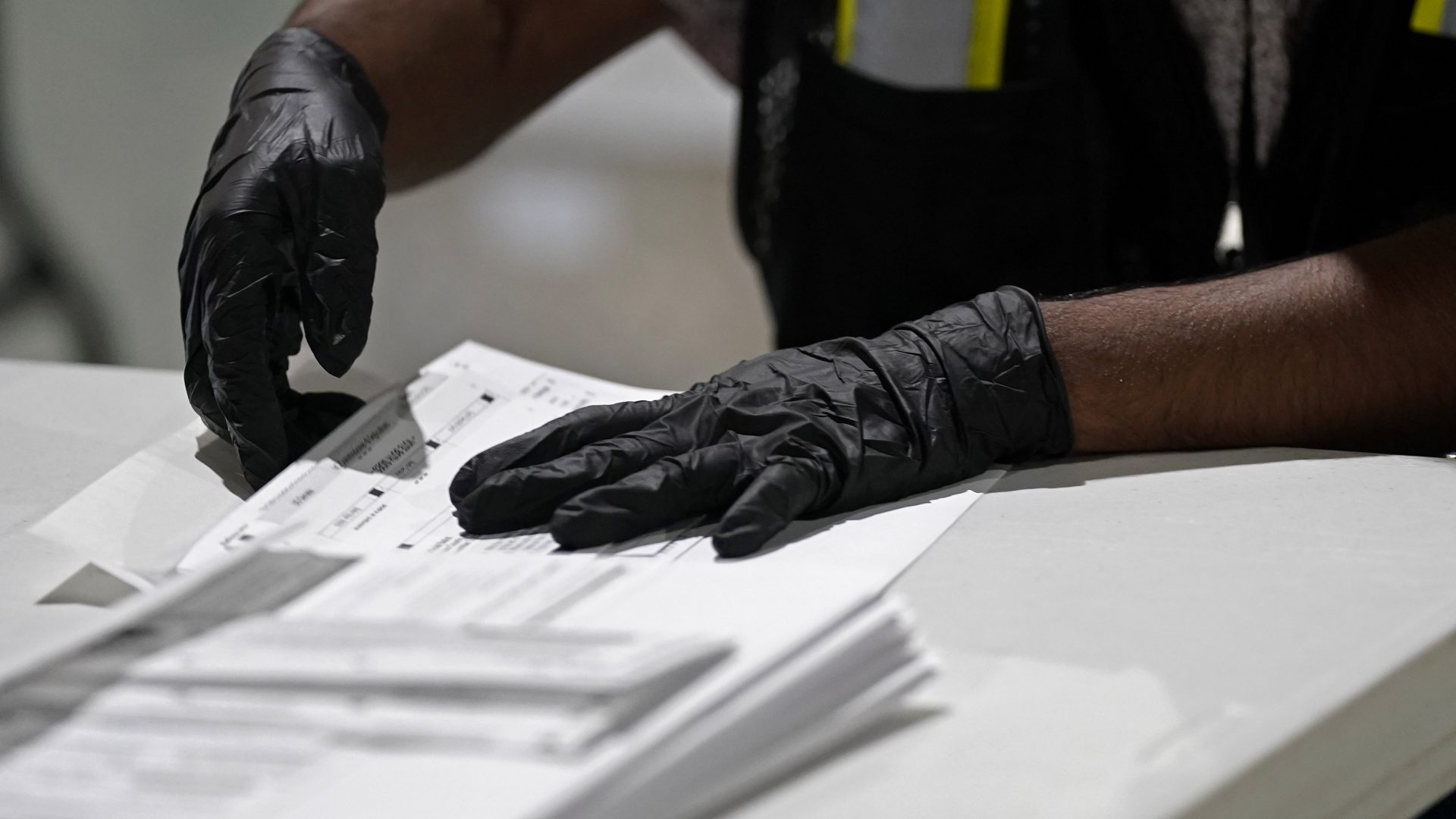 A workers prepares absentee ballots for mailing at the Wake County Board of Elections in Raleigh, N.C., Thursday, Sept. 3, 2020.