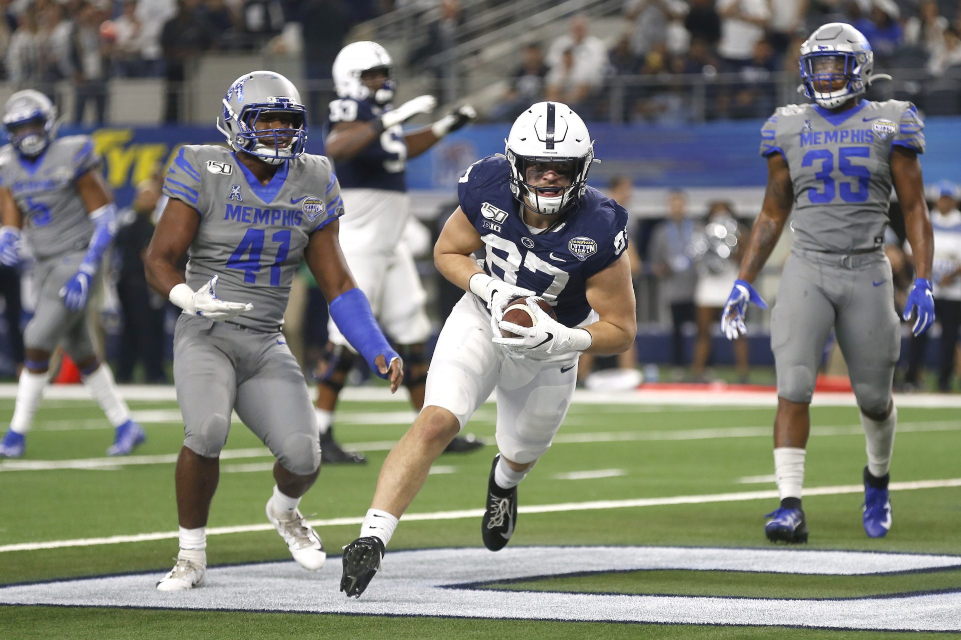 Penn State tight end Pat Freiermuth (87) catches a pass for a two point conversion as Memphis defensive back Sanchez Blake Jr. (41) and linebacker Tim Hart (35) look on in the second half of the NCAA Cotton Bowl college football game, Saturday, Dec. 28, 2019, in Arlington, Texas. Penn State won 53-39.