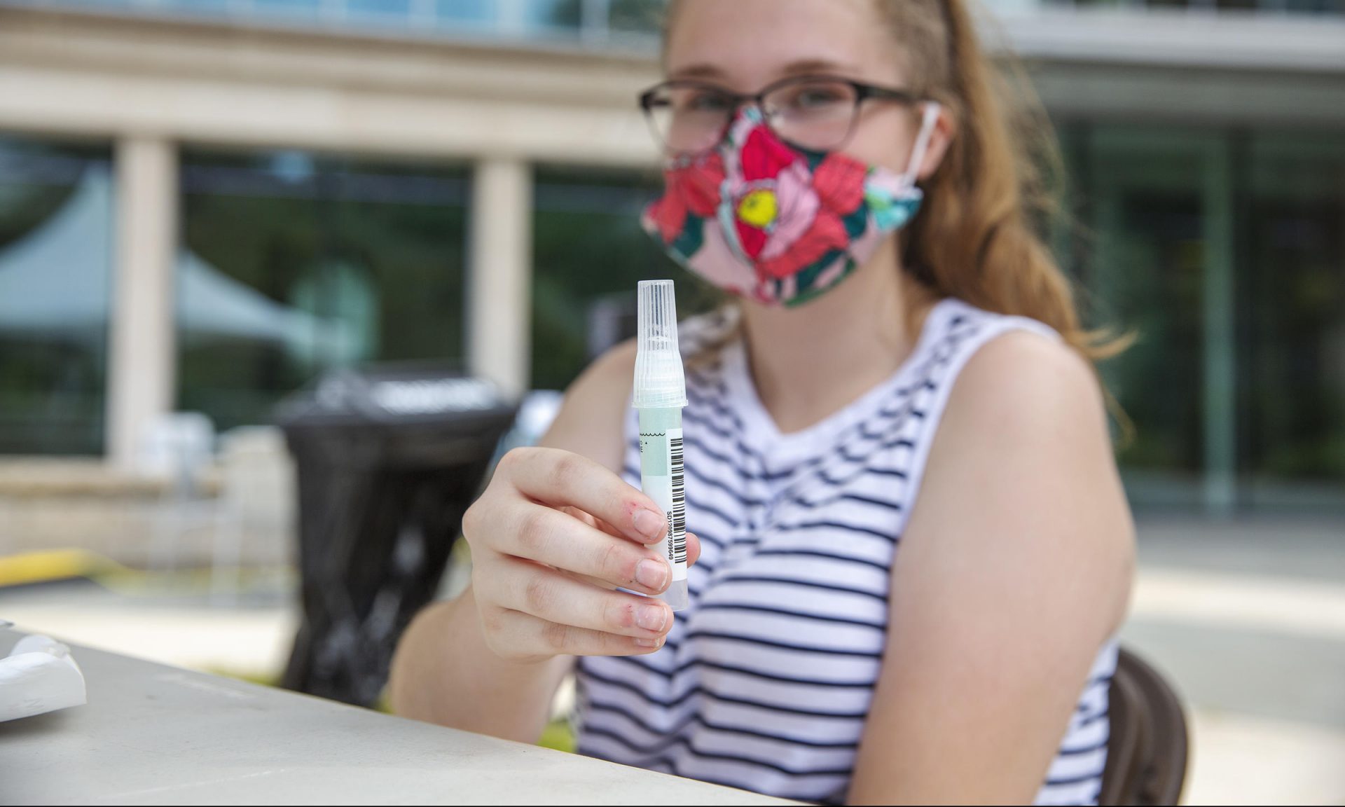 In this file photo, Penn State student Kaitlyn Harris did an asymptomatic saliva test at a mobile testing site in August 2020.
