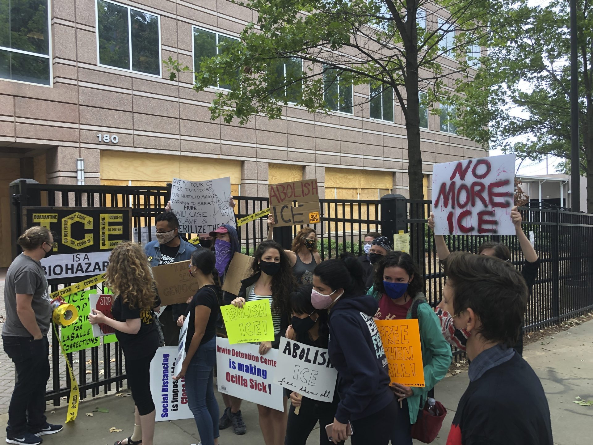 Protesters gather at a news conference Tuesday, Sept. 15, 2020 in Atlanta decrying conditions at Irwin County Detention Center in Ocilla, Georgia. Nurse Dawn Wooten says authorities at the immigration jail denied COVID-19 tests to immigrants, performed questionable hysterectomies and shredded records in a complaint filed to the inspector general of the U.S. Department of Homeland Security.