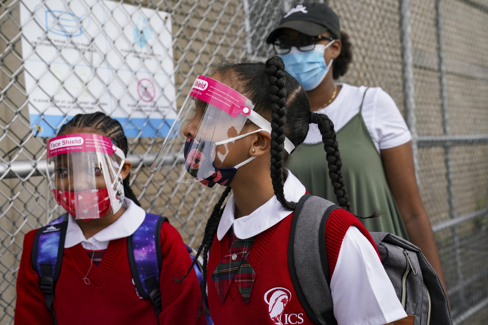 Students wear protective masks as they arrive for classes at the Immaculate Conception School while observing COVID-19 prevention protocols, Wednesday, Sept. 9, 2020, in The Bronx borough of New York.