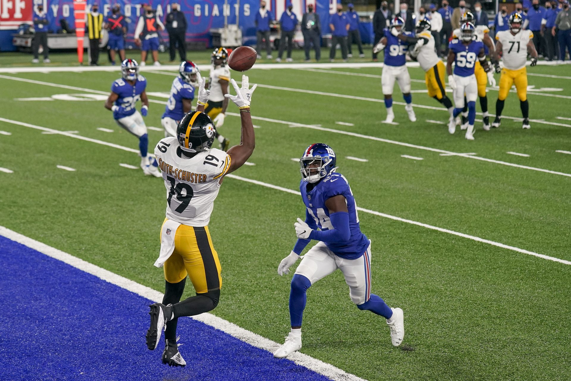 Pittsburgh Steelers wide receiver JuJu Smith-Schuster (19) comes down with a touchdown pass against New York Giants cornerback James Bradberry (24) during the fourth quarter of an NFL football game Monday, Sept. 14, 2020, in East Rutherford, N.J.