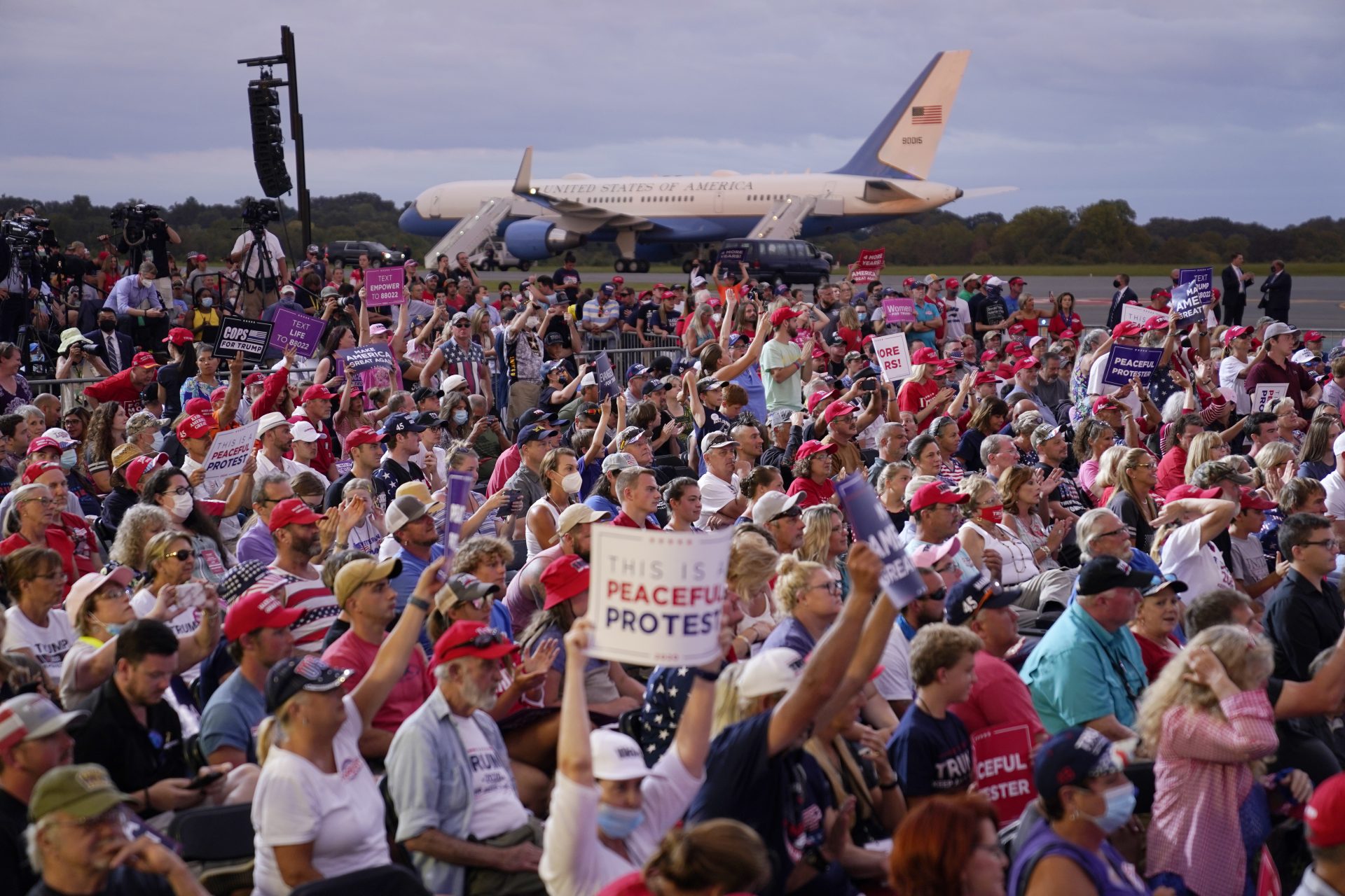 People cheer as President Donald Trump speaks during a campaign rally at Smith Reynolds Airport, Tuesday, Sept. 8, 2020, in Winston-Salem, N.C.