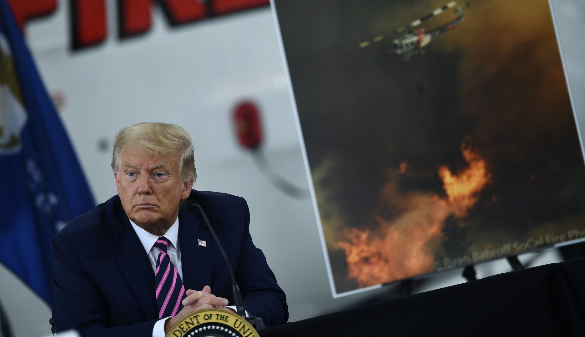 US President Donald Trump speaks during a briefing on wildfires with local and federal fire and emergency officials at Sacramento McClellan Airport in McClellan Park, California on September 14, 2020. 