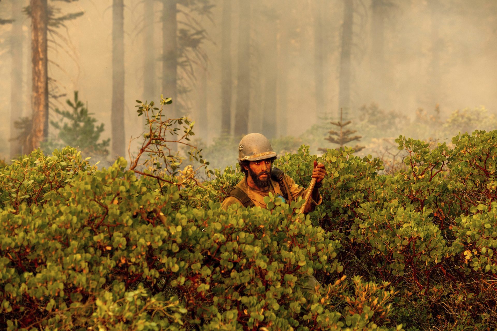 Firefighter Cody Carter battles the North Complex Fire in Plumas National Forest, Calif., on Monday, Sept. 14, 2020.
