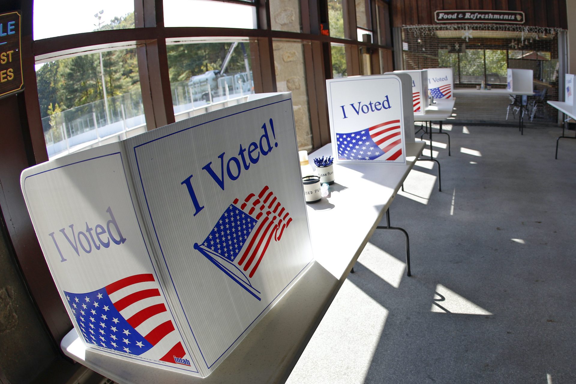 An early election ballot completion area is being prepared at a collection location at the North Park Ice Skating Rink Lodge area, Friday, Oct. 9, 2020, in McCandless, Pa.